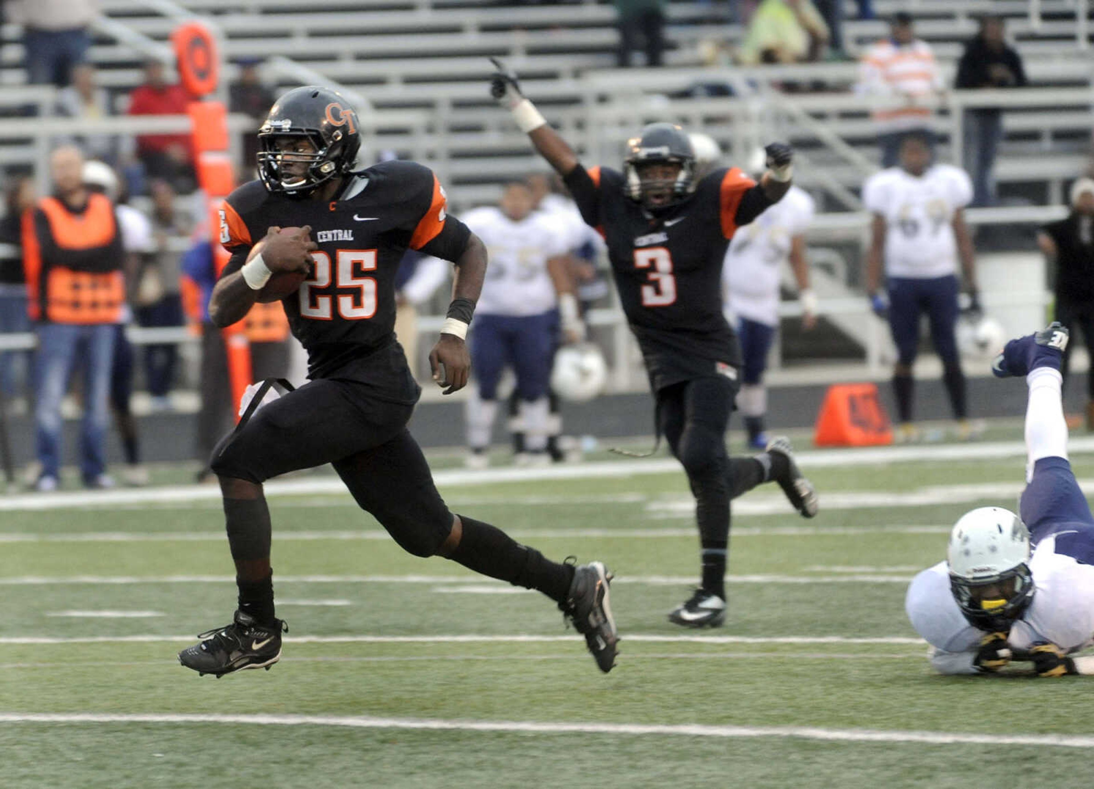 FRED LYNCH ~ flynch@semissourian.com
Central running back Mikey Jones carries to the end zone for the winning touchdown against Miller Career Academy as Jalen Reddin celebrates during the fourth quarter of the Class 4 quarterfinal Saturday, Nov. 16, 2013 in Cape Girardeau.