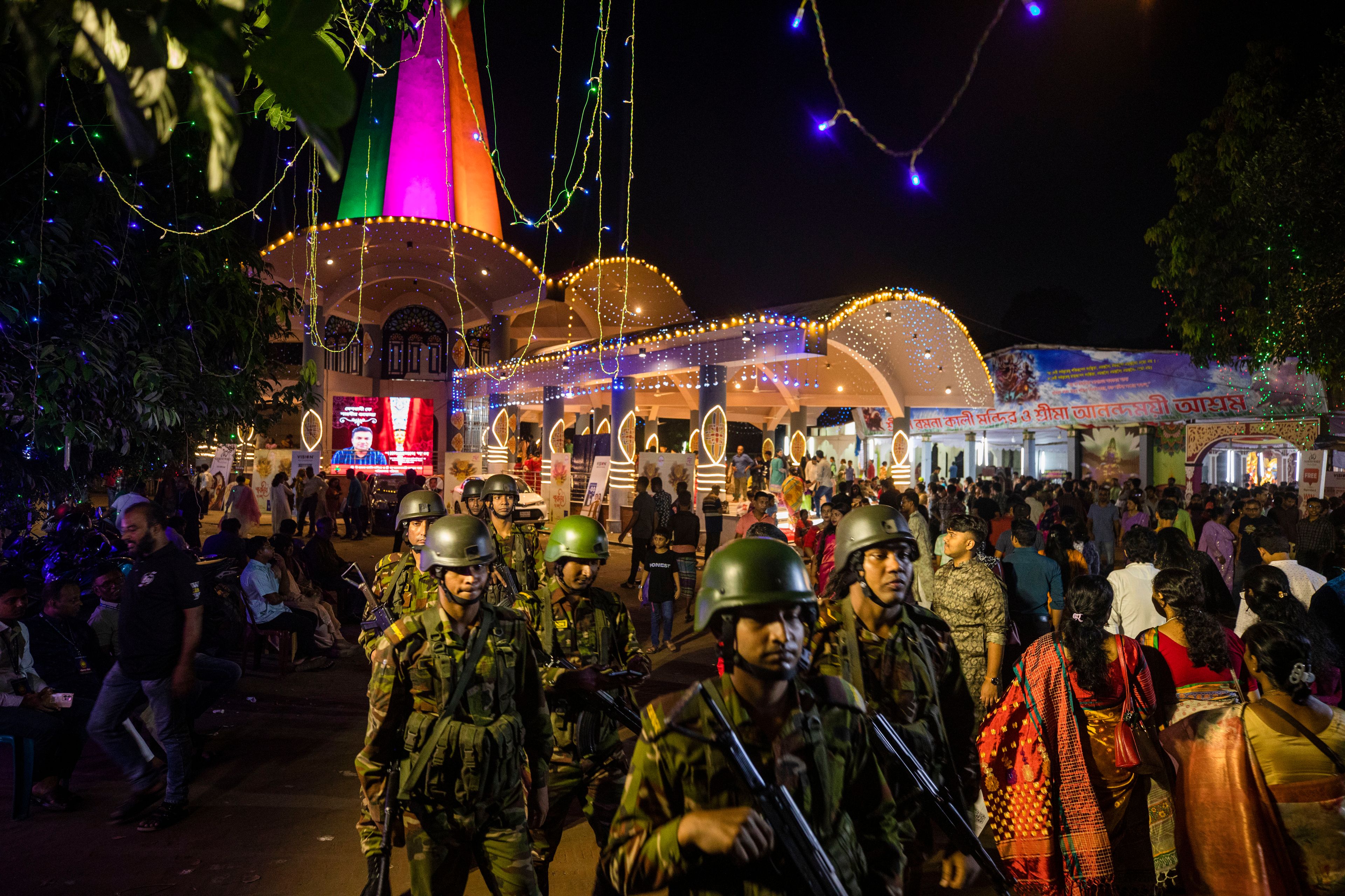 Bangladesh army soldiers patrol around the Dhakeshwari National Temple during the Durgapuja festival in Dhaka, Bangladesh, on Oct. 10, 2024. (AP Photo/Rajib Dhar)