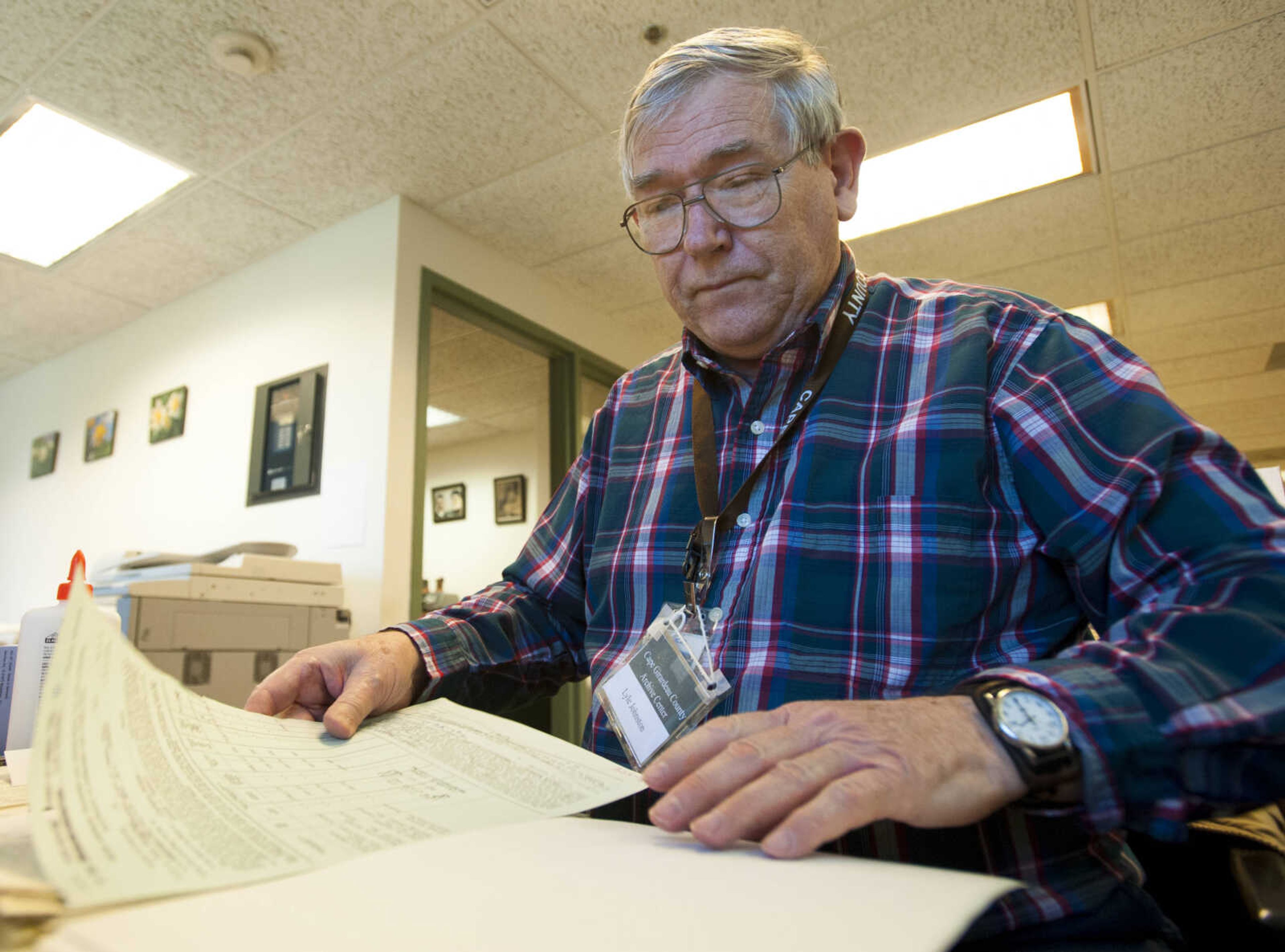 Assistant archivist Lyle Johnston preserves documents Thursday, March 8, 2018, at the Cape Girardeau County Archive Center in Jackson.