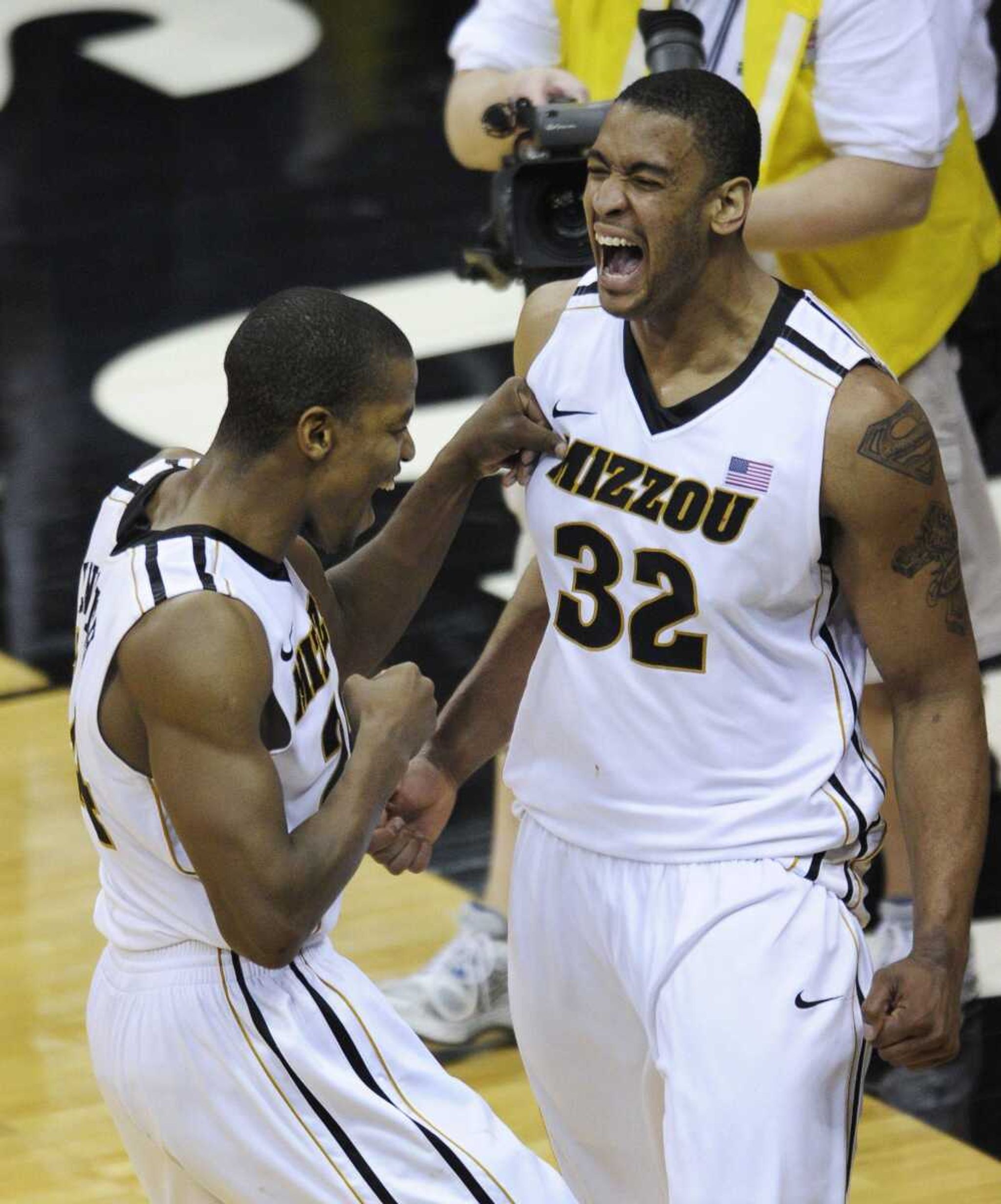 Missouri's Kim English, left, and Steve Moore celebrate Saturday in Kansas City, Mo.