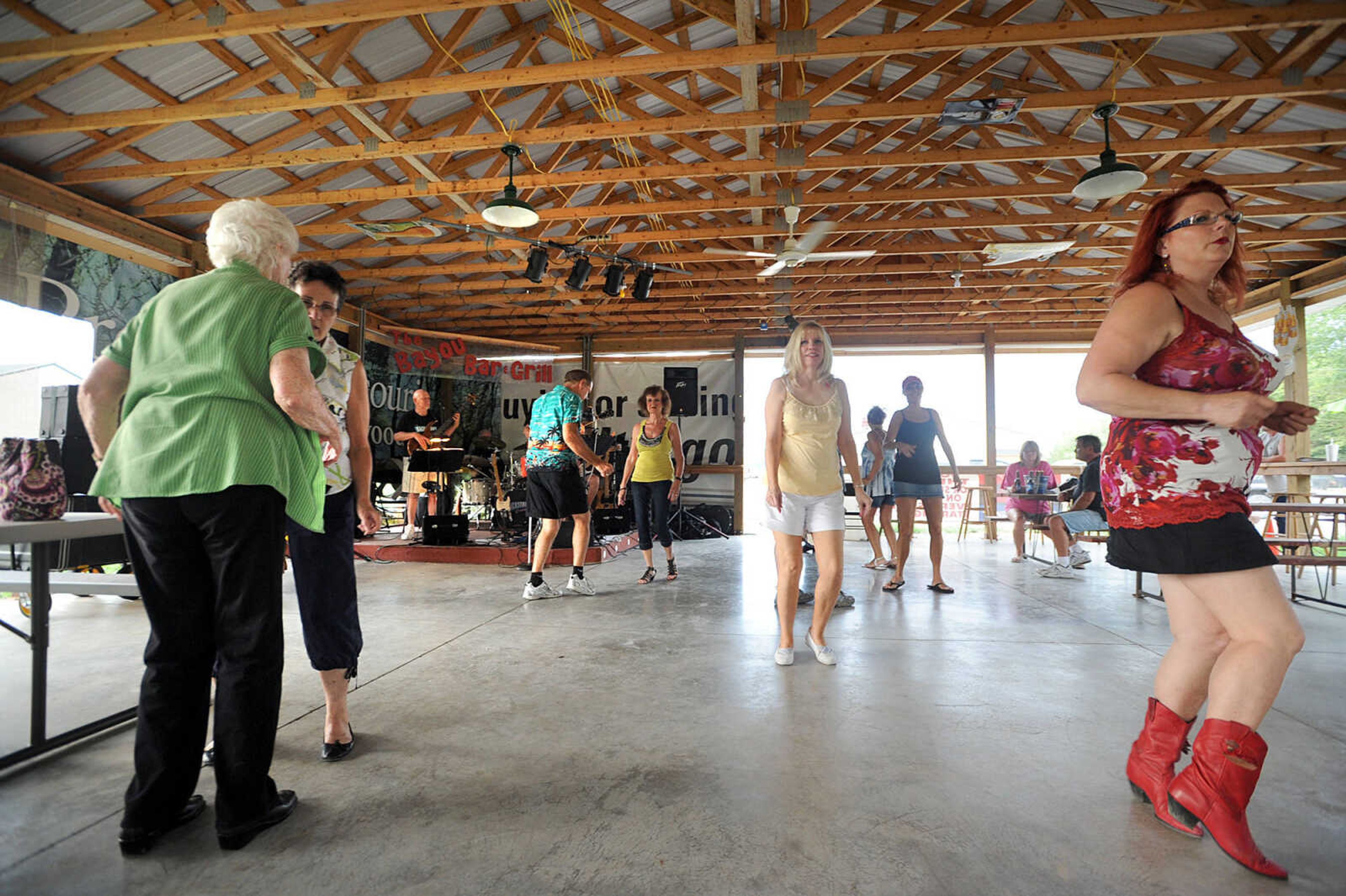 LAURA SIMON ~ lsimon@semissourian.com
People dance to the music of the Backstreet Cruisers Sunday, July 8, 2012 at the Bayou Bar & Grill in Pocahontas, Mo. The St. Louis based band performs music from the 1950's and 60's.