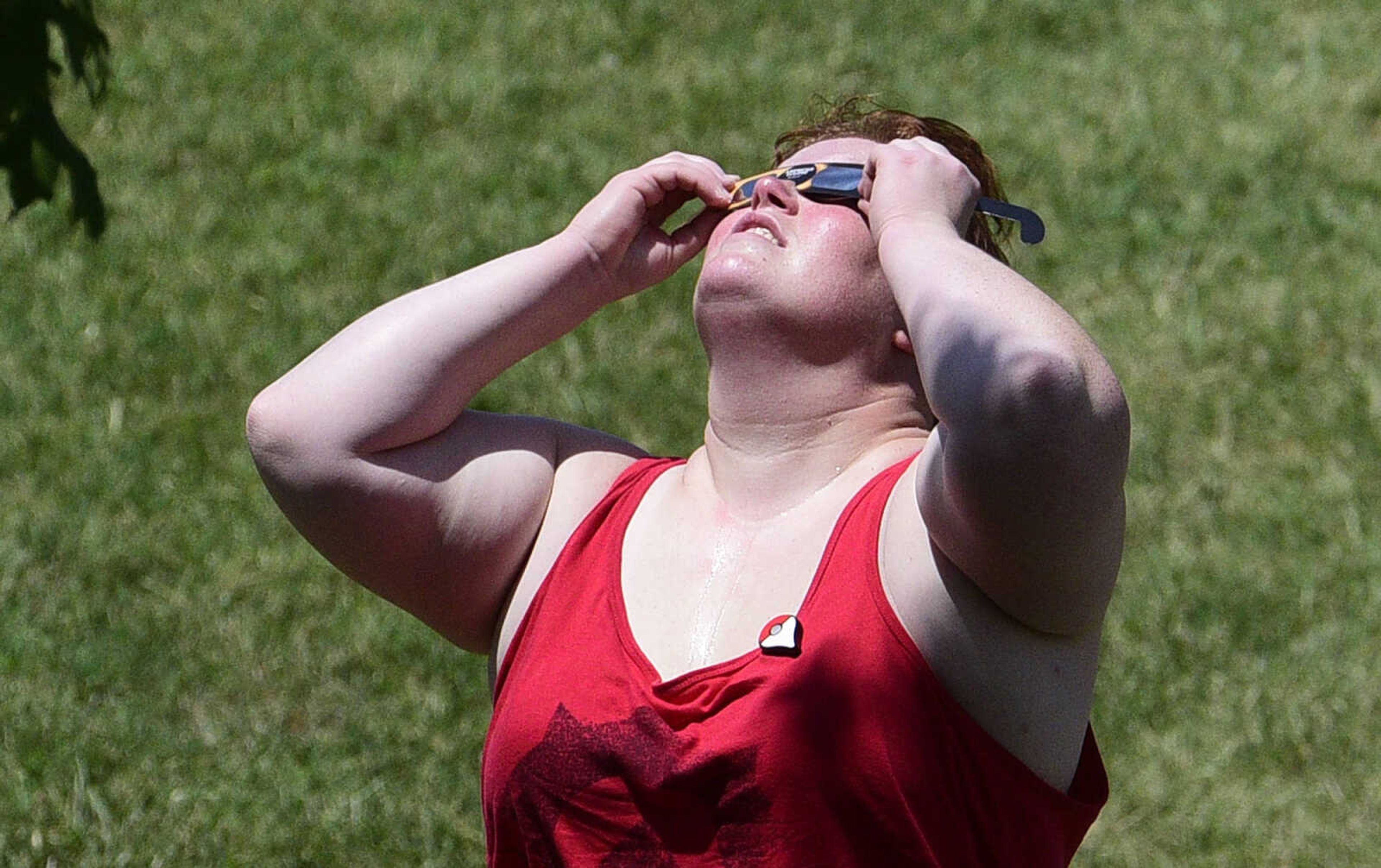 Visitors watch the stages of the solar eclipse on Monday, Aug. 21, 2017, from the River Campus in Cape Girardeau.