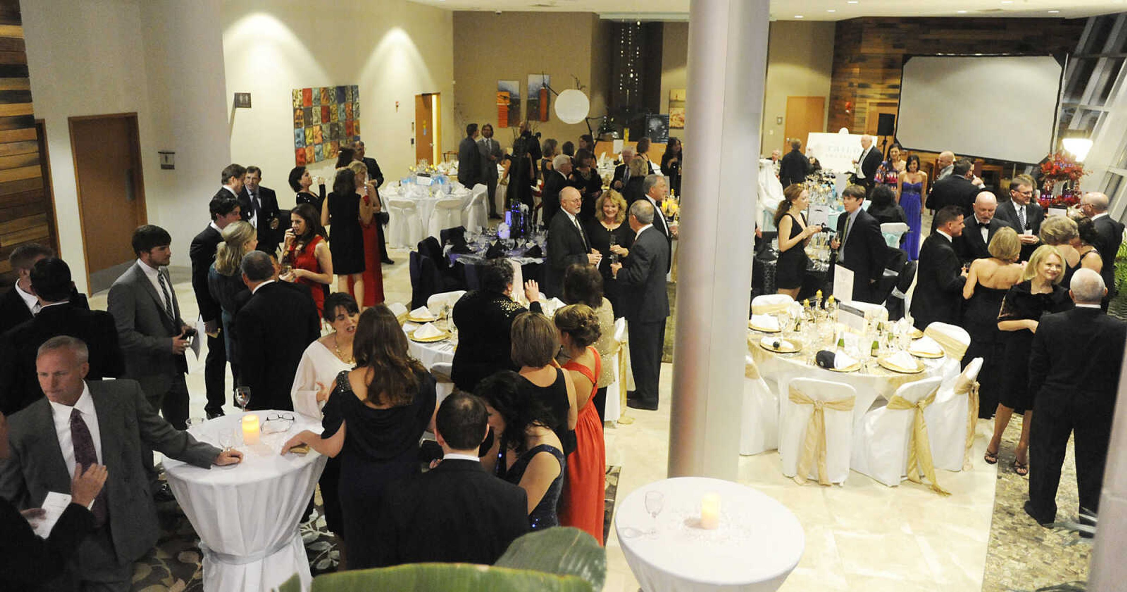 Attendees mingle during a black tie fundraiser for the Tailor Institute Saturday, October 27, at the Southeast Cancer Center. The Tailor Institute helps individuals diagnosed with autism identify and use their special skills and learn to work and live independently. Dr. David Crowe, whose son Taylor is high-function on the autism spectrum, founded the institute in 2003.