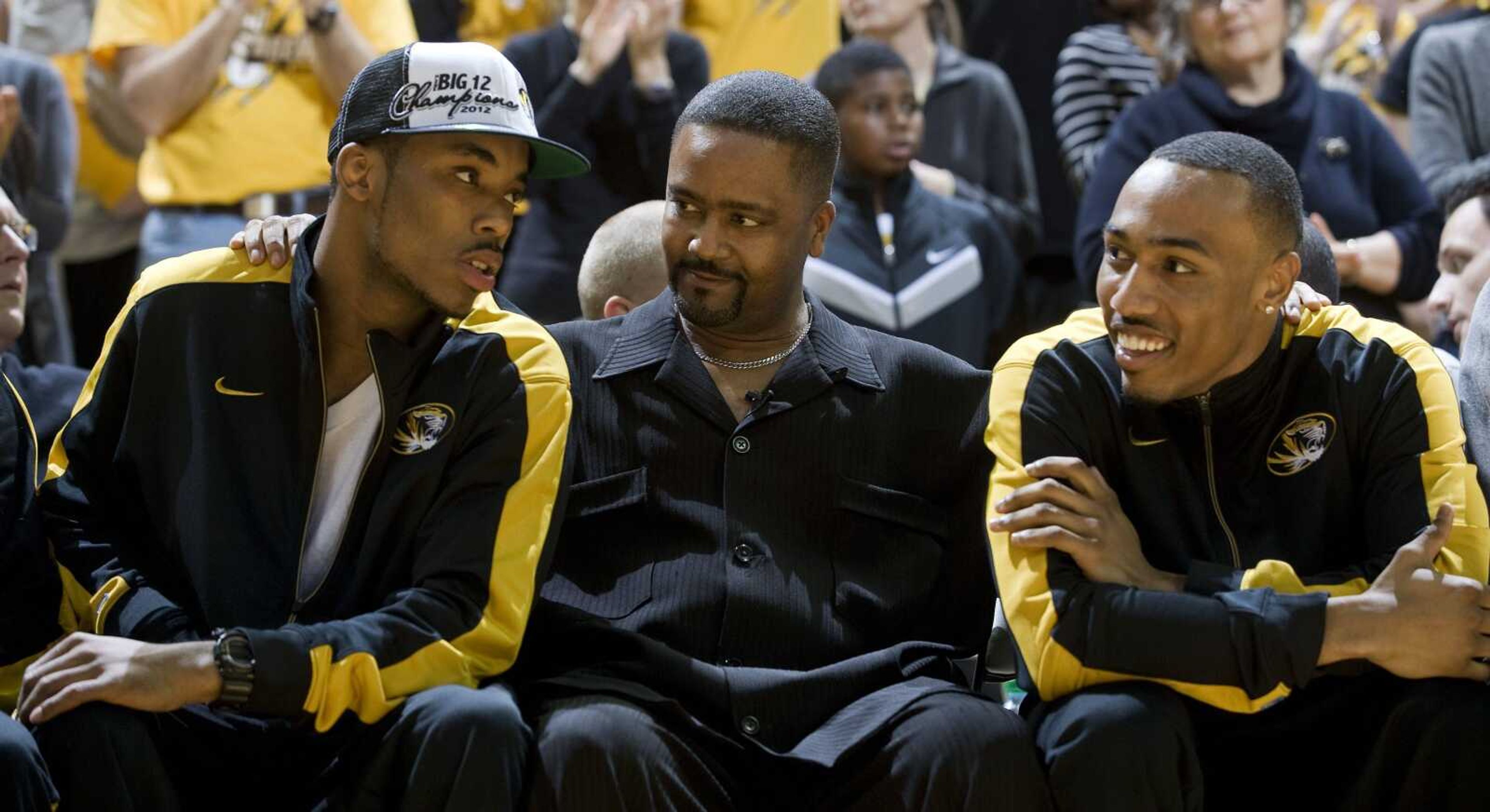 Missouri coach Frank Haith, center, enjoys a moment with Matt Pressey, right, and Marcus Denmon before the start of their NCAA tournament selection party Sunday at Mizzou Arena in Columbia, Mo. (L.G. Patterson ~ Associated Press)