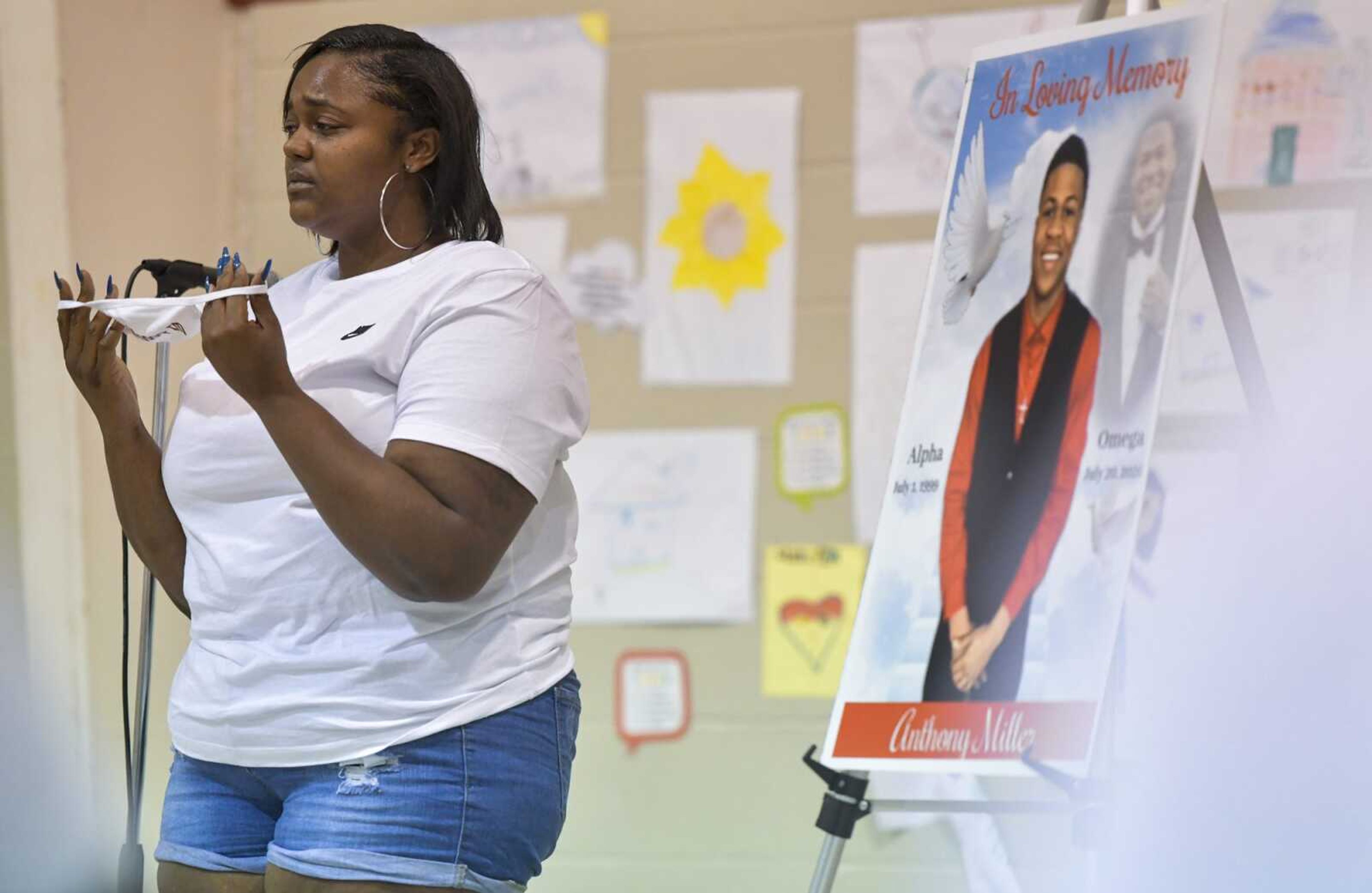 C'ion Miller puts her face mask back on after speaking during a memorial service for Anthony Miller on Saturday at the Salvation Army in Cape Girardeau.