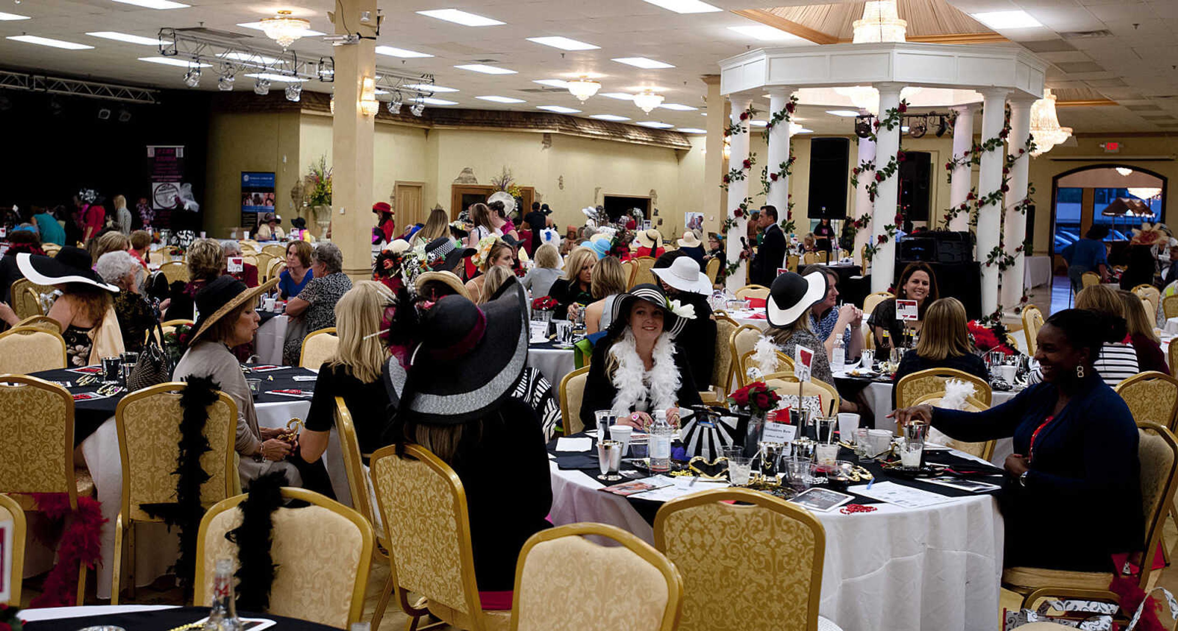 Attendees donned hats boas and a variety of accessories for the Lutheran Family and Children's Services Foundation's "Boas & Bling, Kentucky Derby Party," Thursday, May 1, at The Venue in Cape Girardeau. More than 450 people attended the annual event  which is a fundraiser for the not-for-profit social services organization which provides counseling, adoption services, child care, youth mentoring services and advocacy on behalf of children and families.