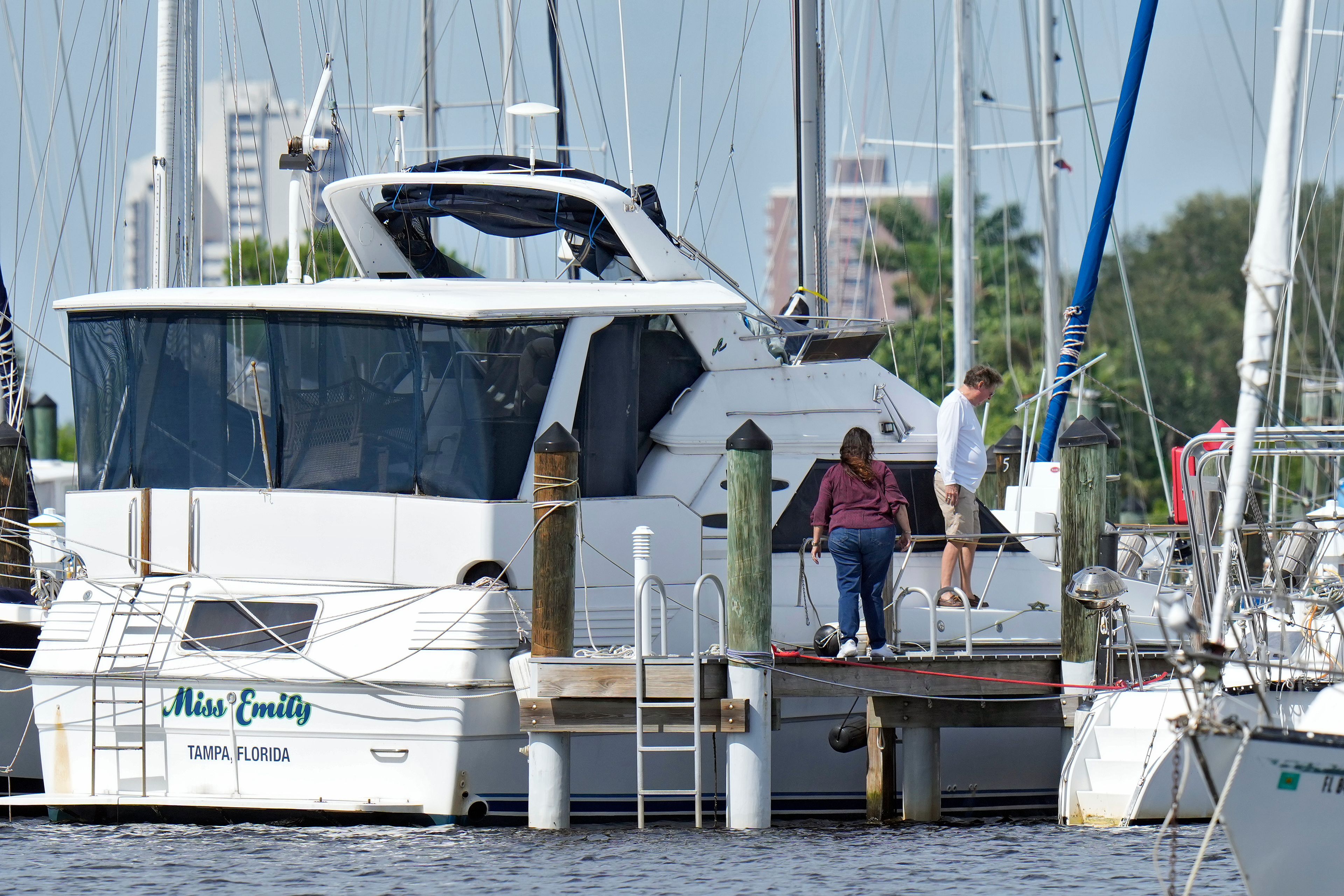 Owners secure their boats outside the Davis Islands Yacht Club Wednesday, Sept. 25, 2024, ahead of Hurricane Helene in Tampa, Fla. (AP Photo/Chris O'Meara)