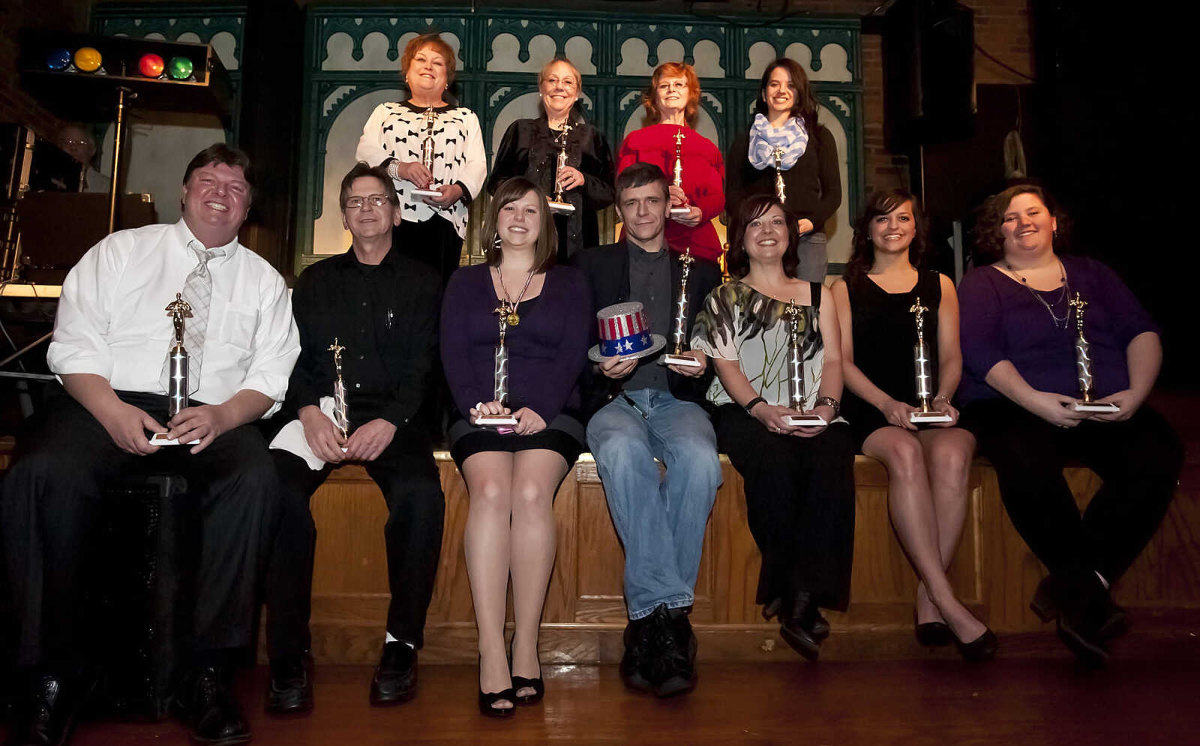 Abbott  Award winners Joy Baldwin (back row from left) Roseanna Whitlow-Greenwood, Brenda Ferguson and Whitney Tankersley, Larry Davis (front row from left) Bill Dunn, Katrina Toeniskoetter (who accepted the award for her husband, Michael) Paul King, Melissa Wade, Maria Drury and Ally Boyland pose for a portrait after the Abbott Awards, the River City Players' annual awards ceremony, Saturday, Jan. 18, at Port Cape in downtown Cape Girardeau. Auditions for the first production of the 2014 season, "Quiet on the Set," will be held at 7 p.m. Jan. 29 and 30 at Port Cape.