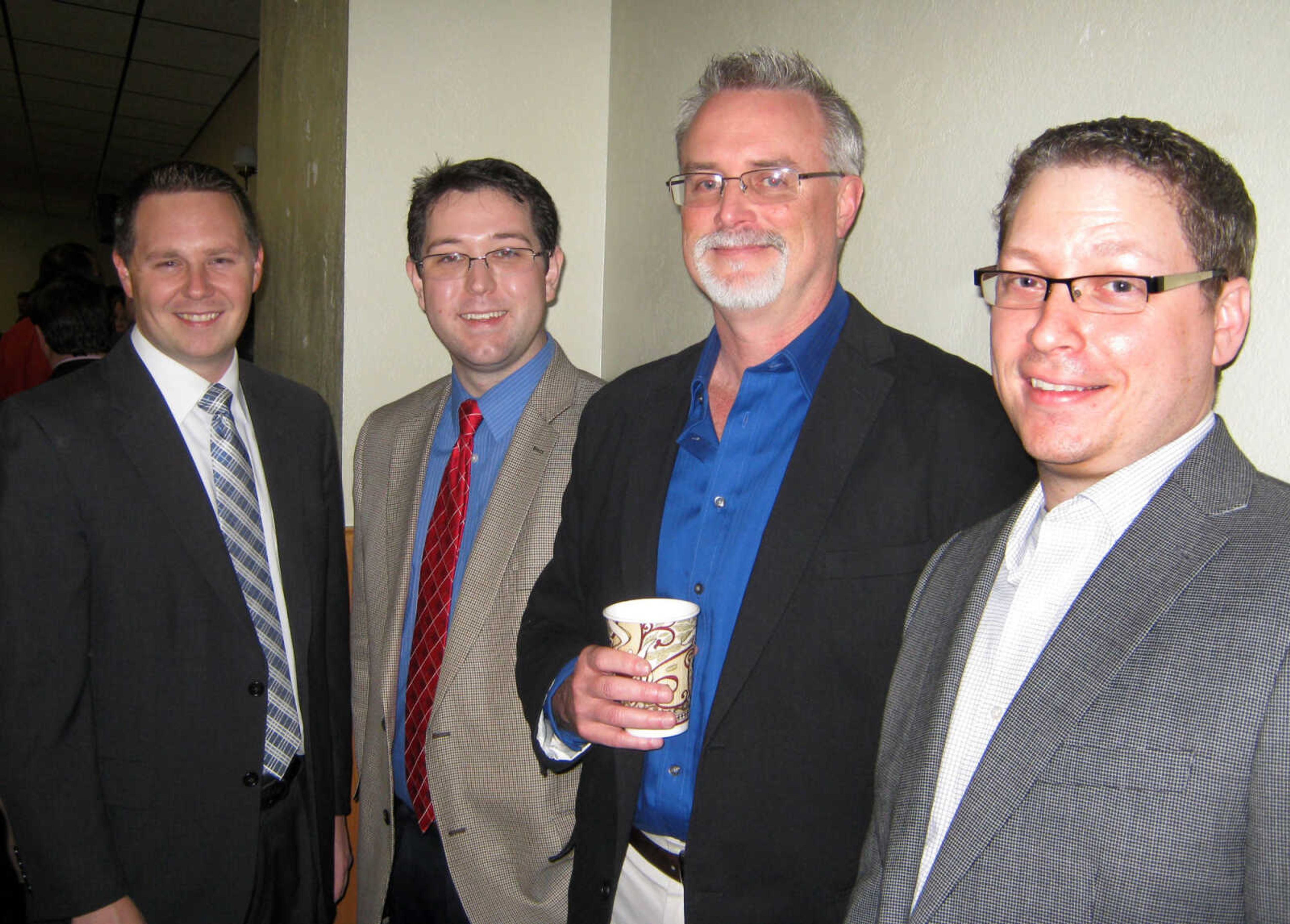 Shad Burner, Rust Media, left; Lucas Presson, Southeast Missourian; Steve Turner, Rust Media; and Bob Miller, Southeast Missourian, pose at the Jackson Area Chamber of Commerce annual awards banquet, Jan. 11, at the the Knights of Columbus Hall in Jackson, Mo.