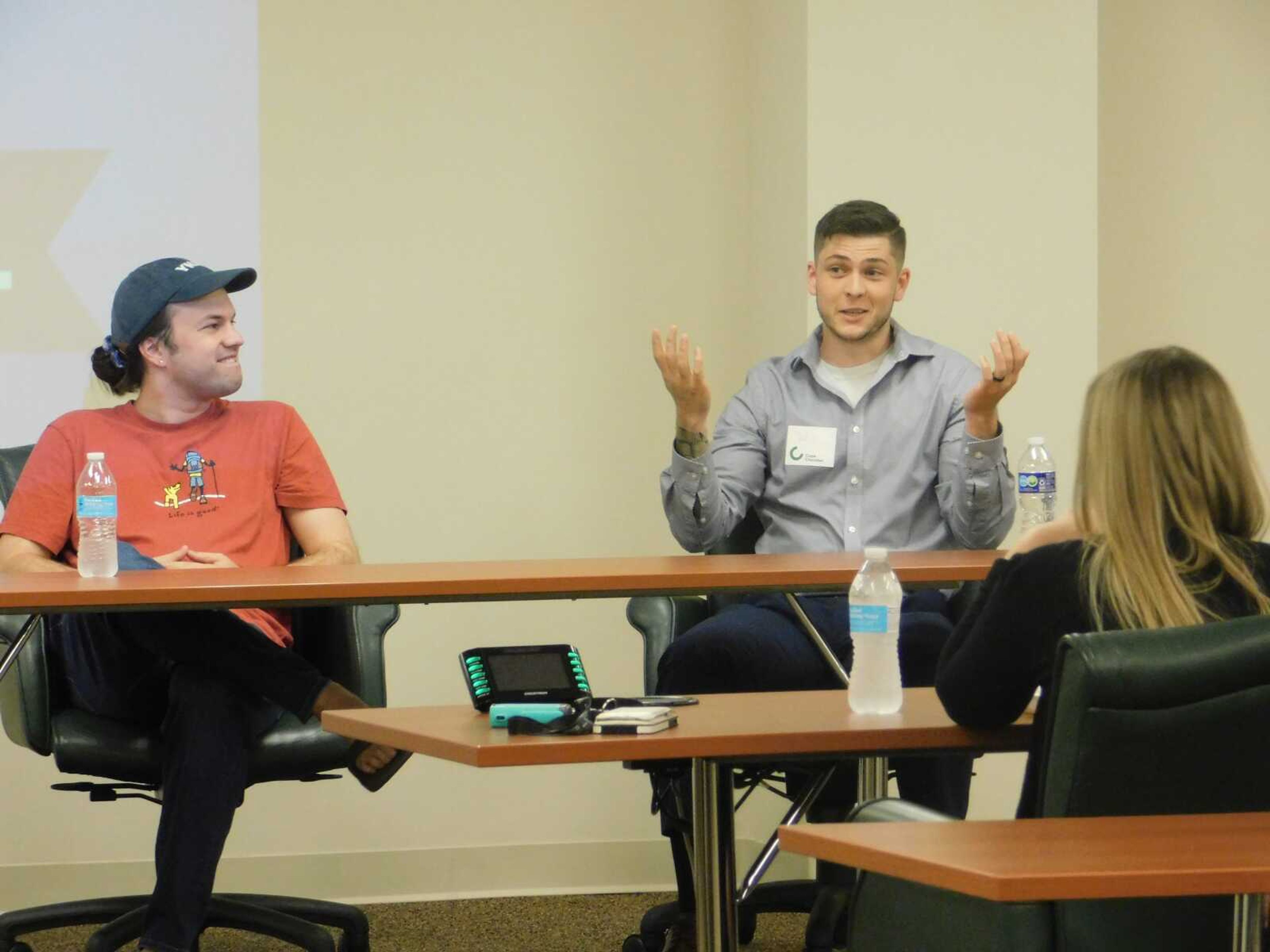 Tech startup leaders Aaron Smothers, left, and Will Wilder talk artificial intelligence implementation for business at a Lunch and Learn event Tuesday, Aug. 15, at The Bank of Missouri in Cape Girardeau. They told local business owners some of the ways they can use AI to help their companies attract customers and improve workflow.