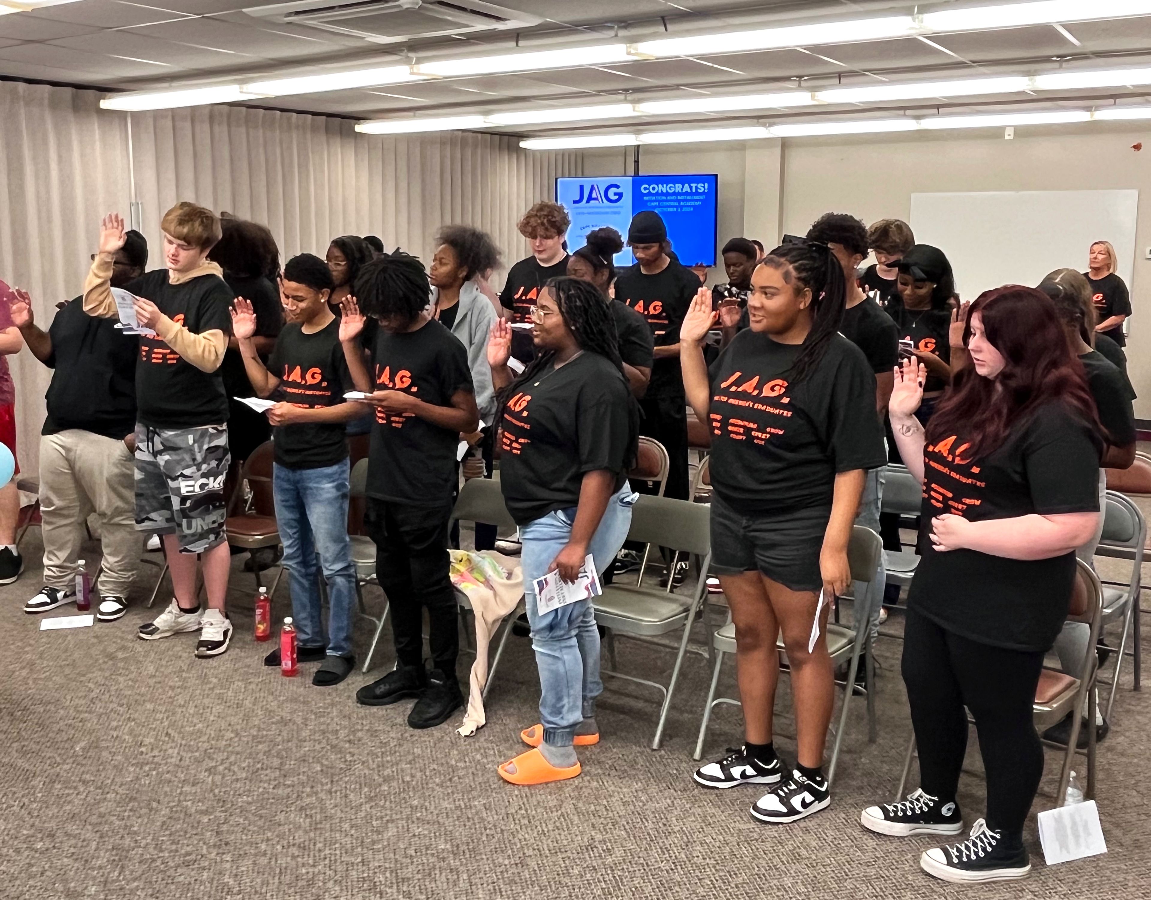 Cape Girardeau Central Academy's JAG members make their pledges to the program during an installment ceremony Wednesday, Oct. 2, at Cape Girardeau Public Schools' Central Administrative Offices.