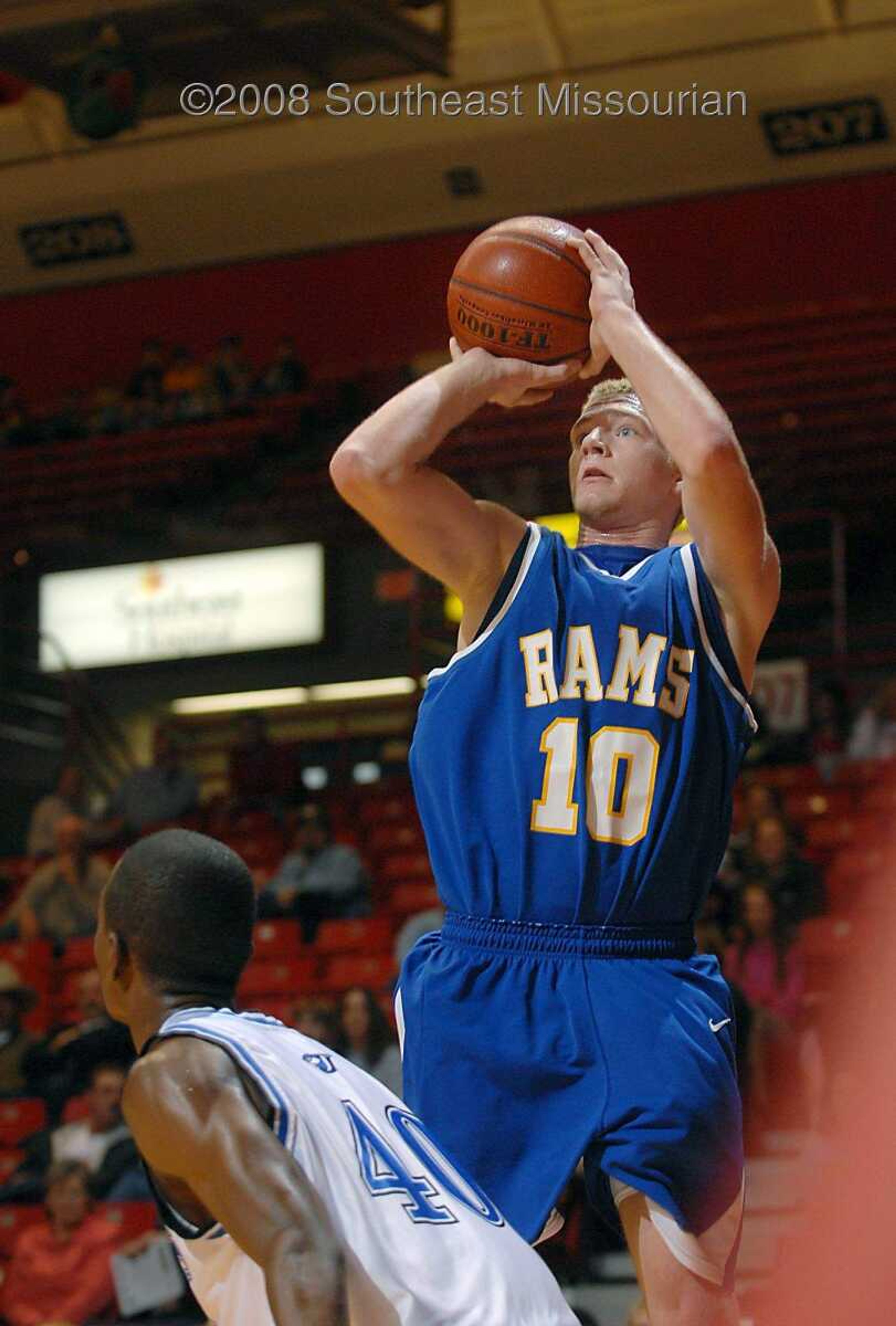 KIT DOYLE ~ kdoyle@semissourian.com
Scott City's Cody Page shoots over Charleston defender Deonte Jones Friday, December 26, 2008, in the first round of the Southeast Missourian Christmas Tournament at the Show Me Center.