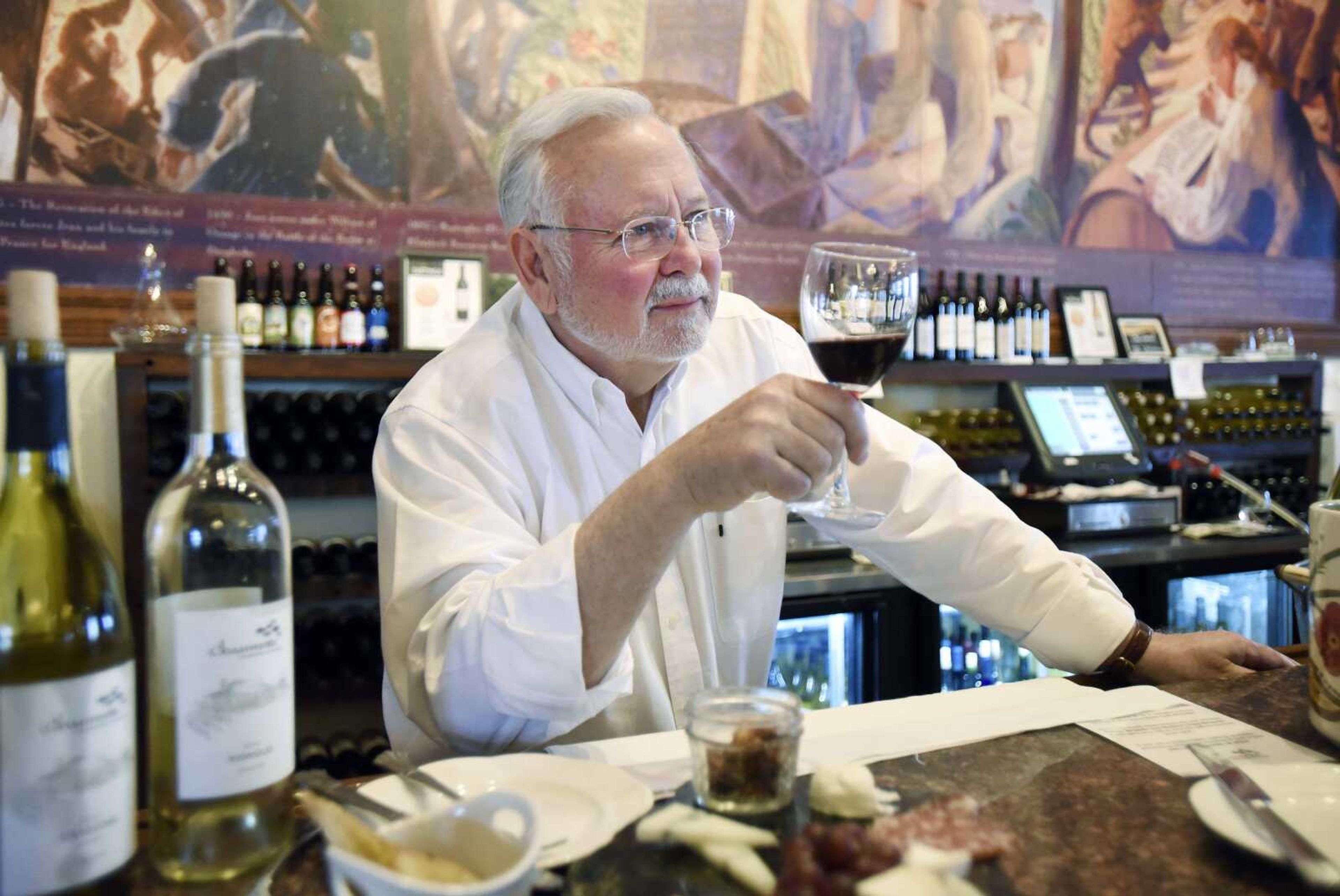 LAURA SIMON ~ lsimon@semissourian.com    Hank Johnson, owns of Chaumette Vineyards & Winery, holds a sample of the 2015 Chambourcin Reserve in the tasting room on Friday, March 17, 2017, in Ste. Genevieve, Missouri.