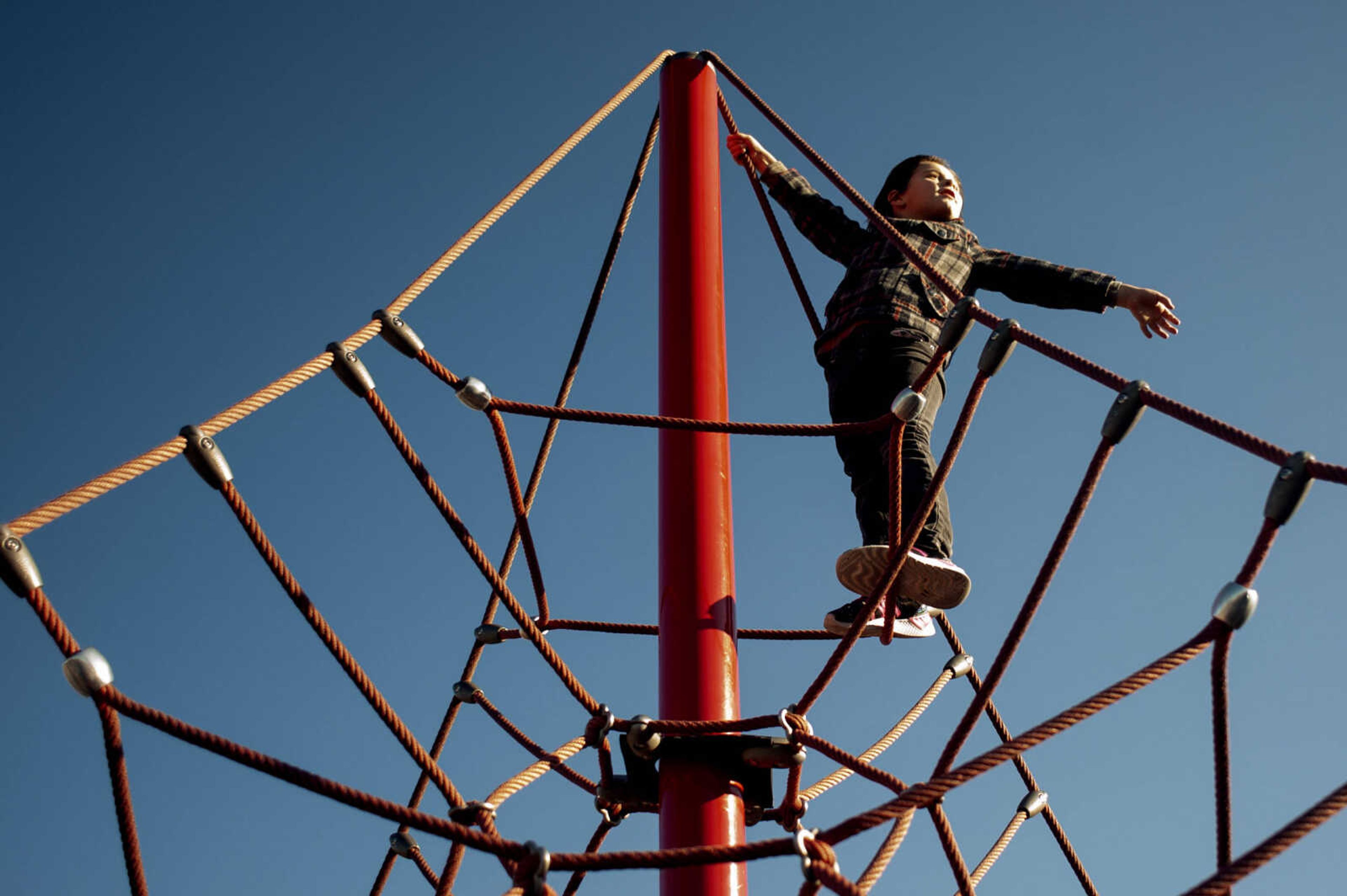 Savannah Sloan, 6, of Benton, Missouri, pauses at the top of a climbing attraction Tuesday, Nov. 19, 2019, at Melaina's Magical Playland at Cape County Park North in Cape Girardeau.