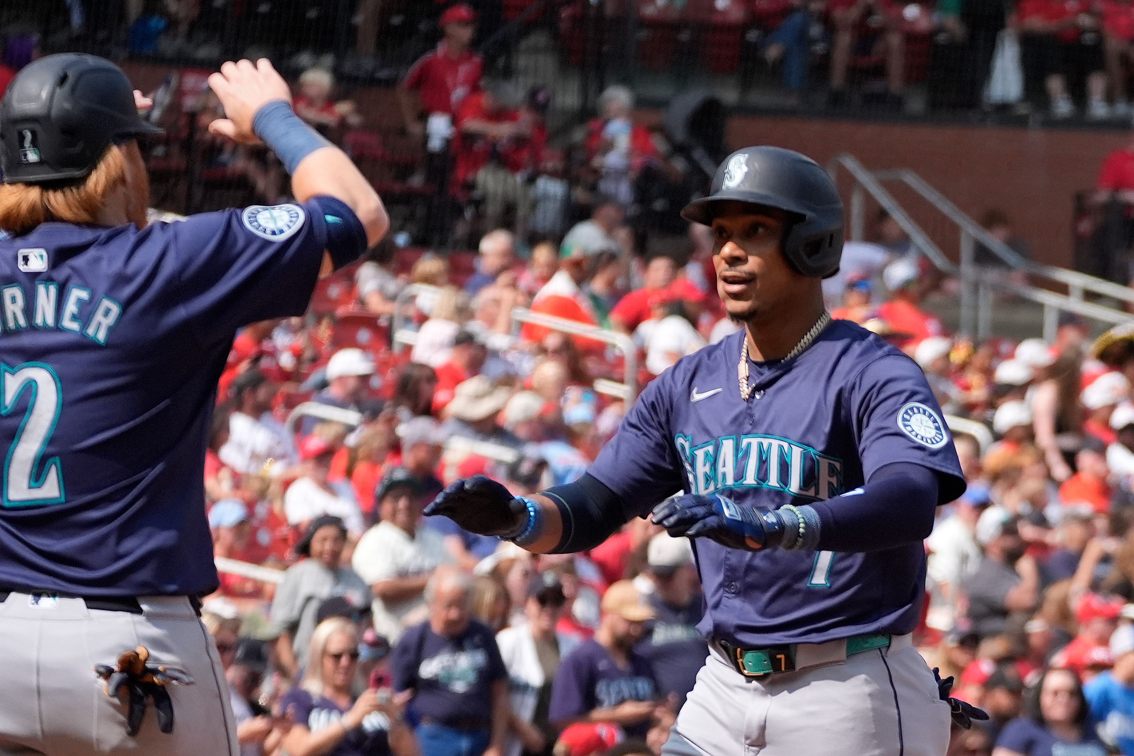 Seattle Mariners' Jorge Polanco, right, is congratulated by teammate Justin Turner (2) after hitting a two-run home run during the fifth inning of a baseball game against the St. Louis Cardinals Sunday, Sept. 8, 2024, in St. Louis. (AP Photo/Jeff Roberson)