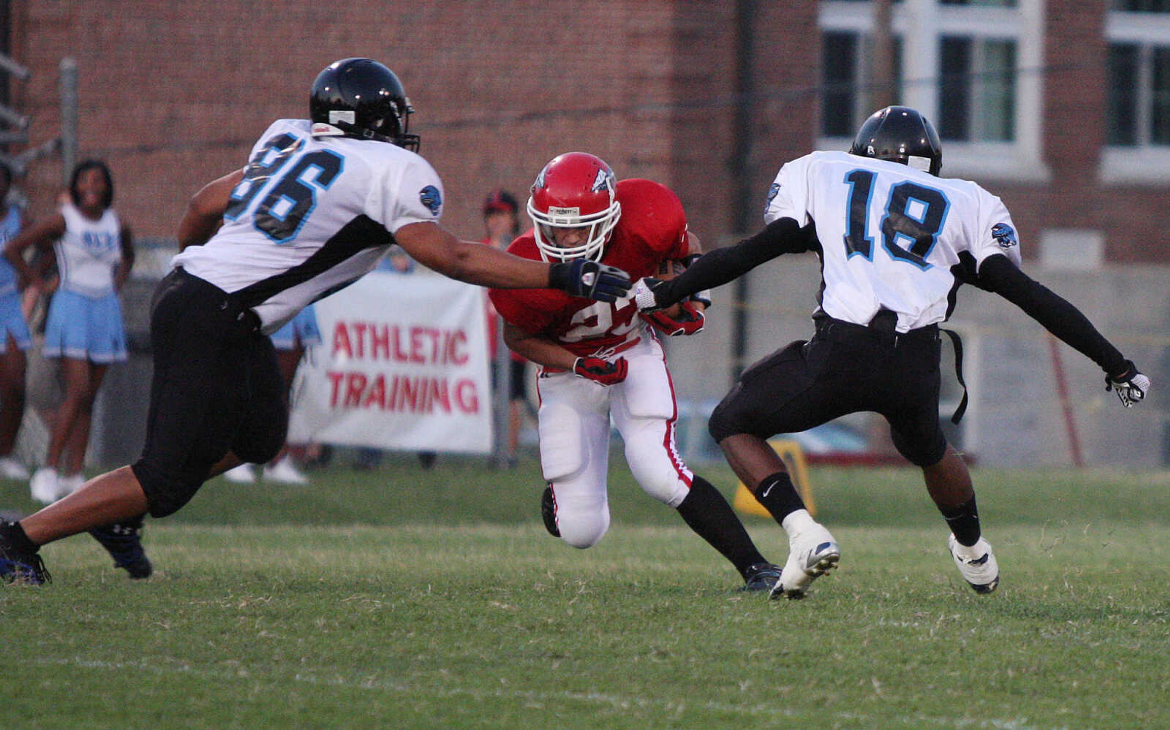 Jackson's Cody Kester gets double teamed during a punt return.