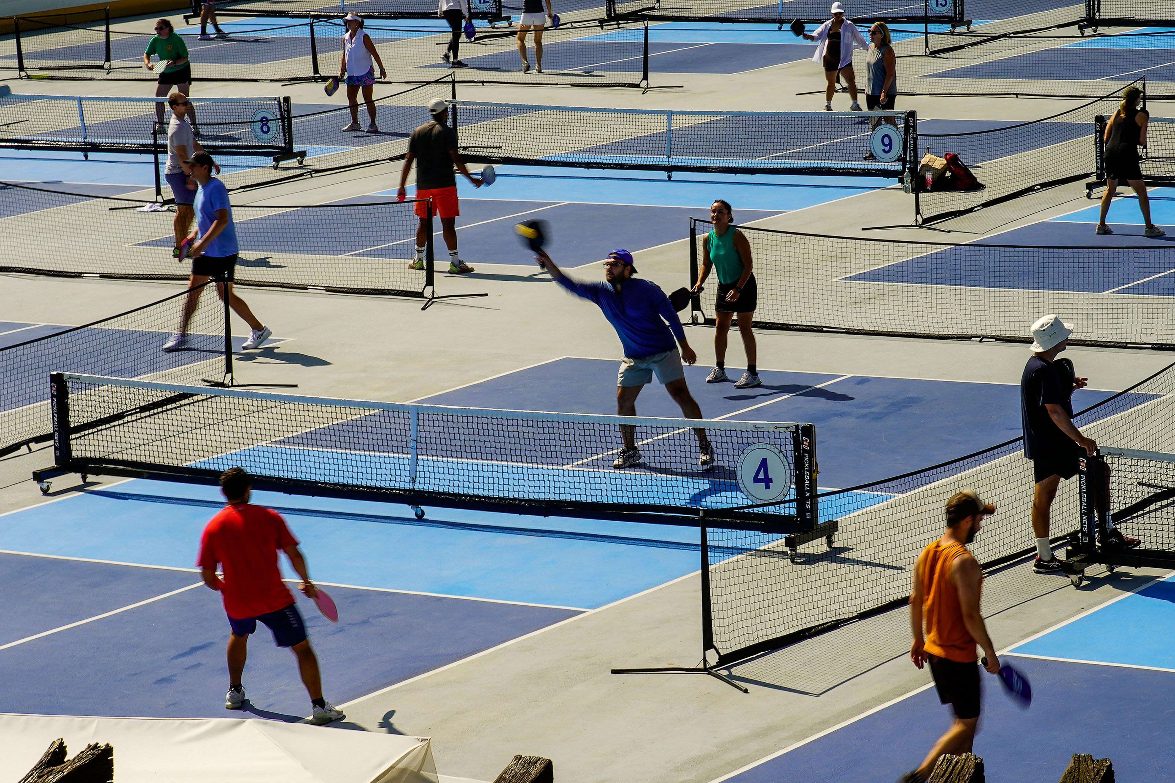 People practice pickleball on the courts of CityPickle at Central Park's Wollman Rink, Saturday, Aug. 24, 2024, in New York. (AP Photo/Eduardo Munoz Alvarez)