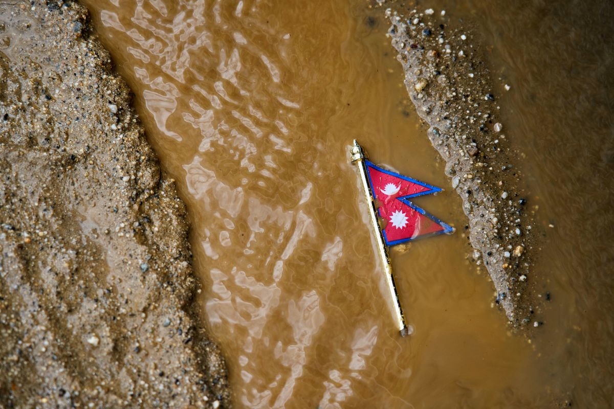 Rescuers comb through mud and debris as Nepal-China floods l...