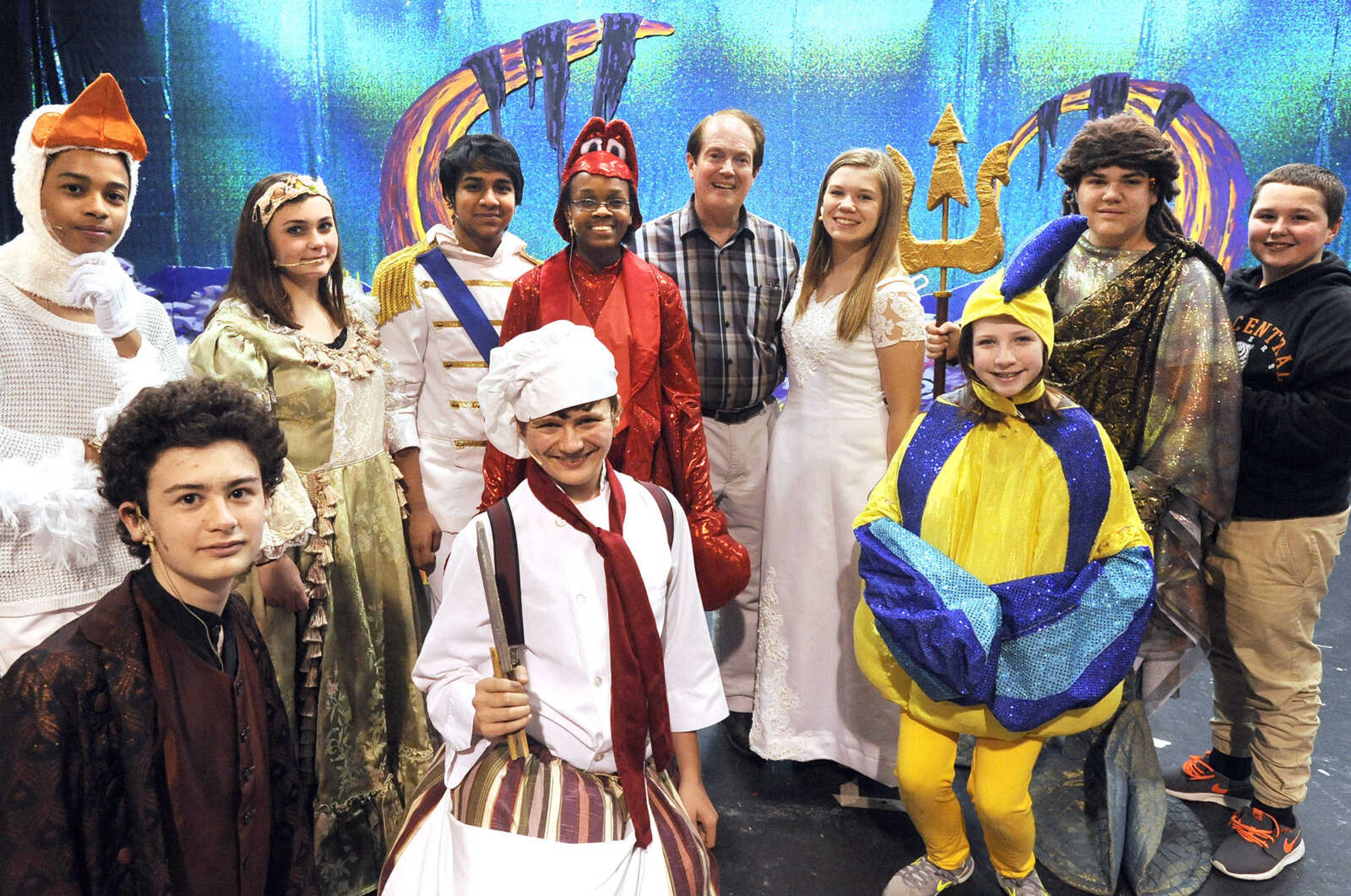 LAURA SIMON ~ lsimon@semissourian.com

Mike Dumey, choir teacher and director of Cape Central Junior High School's production of 'The Little Mermaid', poses for a photo with some of the students in the school's latest musical, Tuesday, March 1, 2016.