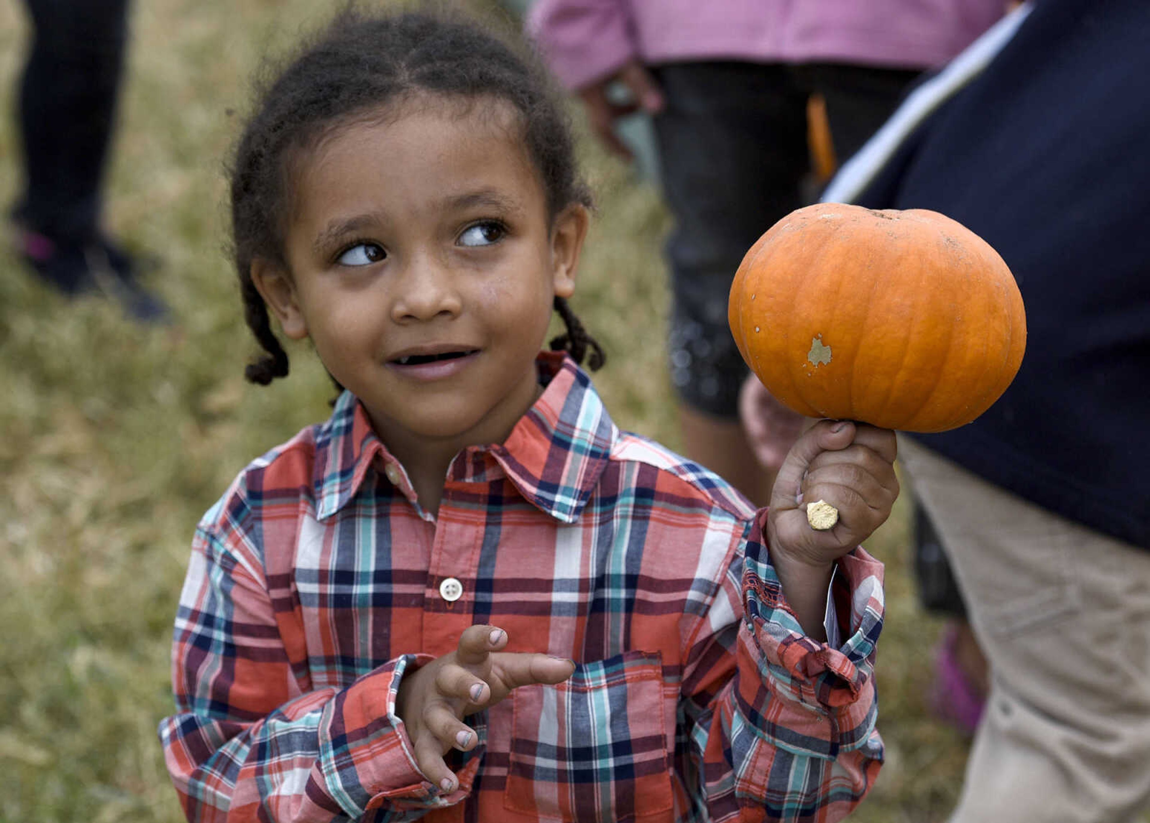 LAURA SIMON ~ lsimon@semissourian.com

Manuel Espinoza picks out his pumpkin at the Grace United Methodist Church pumpkin patch on Wednesday, Oct. 12, 2016 in Cape Girardeau.