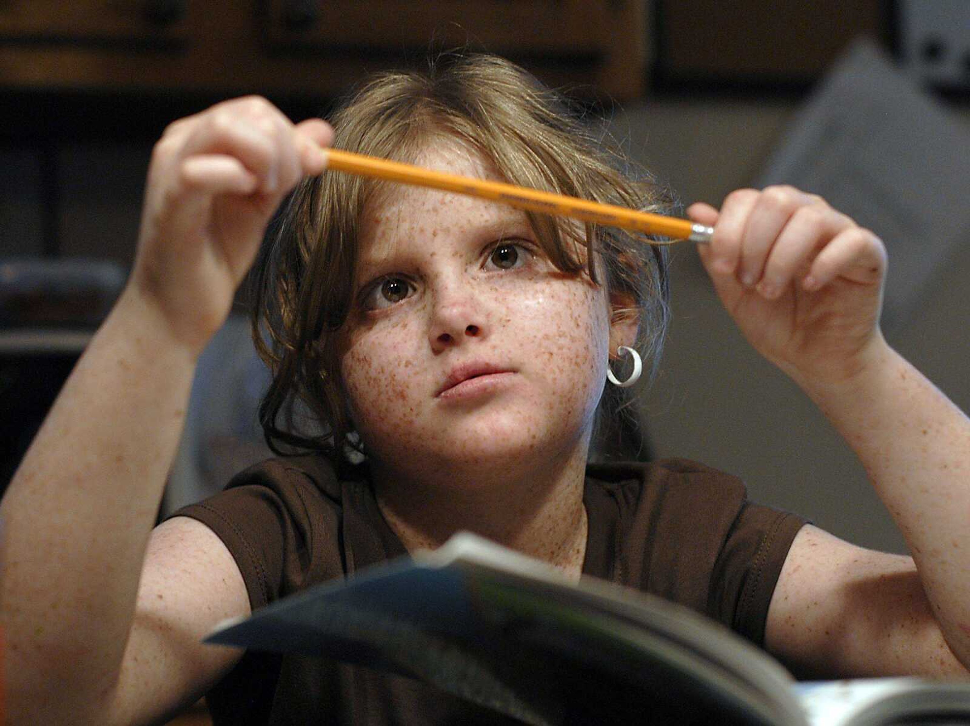 FRED LYNCH ~ flynch@semissourian.com
First-grader Graycen Beardslee of Blodgett, Mo., takes a break from homework. She has a rare skin condition, xeroderma pigmentosum.