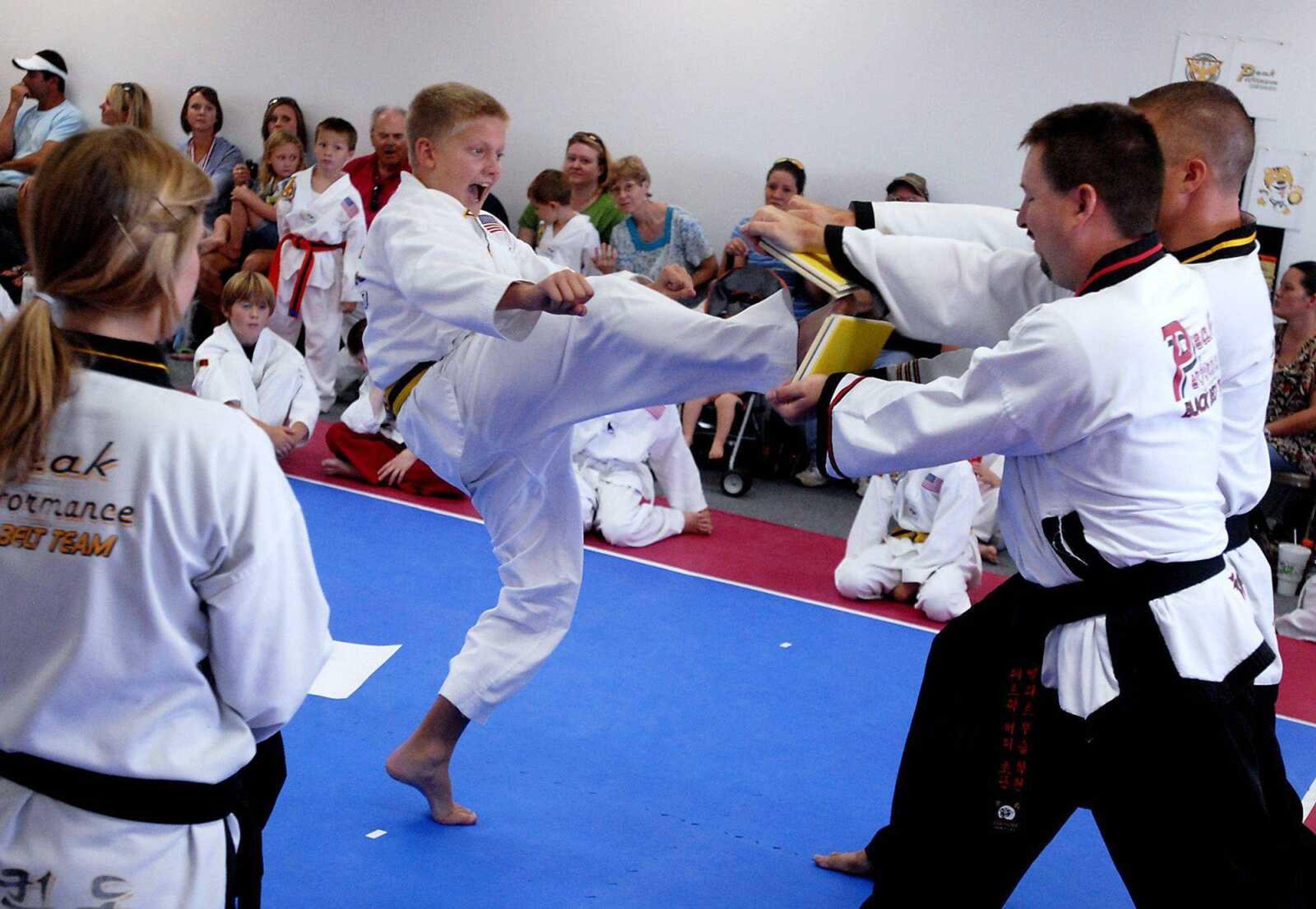 Yellow belt Landon Urhahn competes during the board breaking segment of a Tae Kwon Do tournament at Peak Performance in Cape Girardeau, on Saturday, August 28, 2010. Urhahn placed first in his group for the board breaking competition. The tournament included participants from Cape Girardeau, Sikeston, Scott City, and Portageville, and raised money for the SEMO Autism Center for Diagnosis and Treatment. (Kristin Eberts)