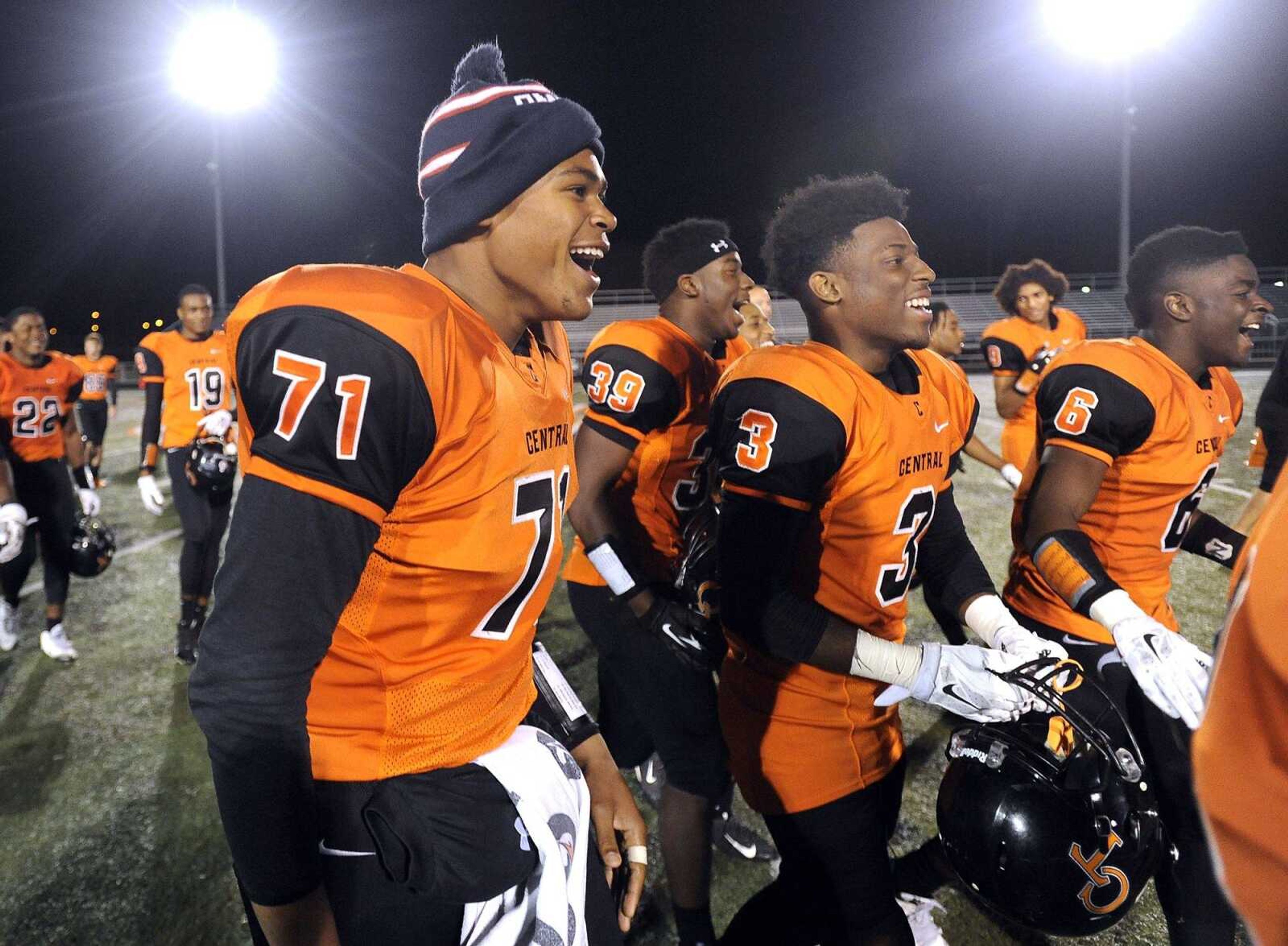 Cape Central's Patrick Buck, left, Tyler Banks and Blake Harris celebrate after their 35-15 victory over Farmington in the Class 4 District 1 championship Friday, Nov. 6, 2015 at Cape Central High School. (Fred Lynch)