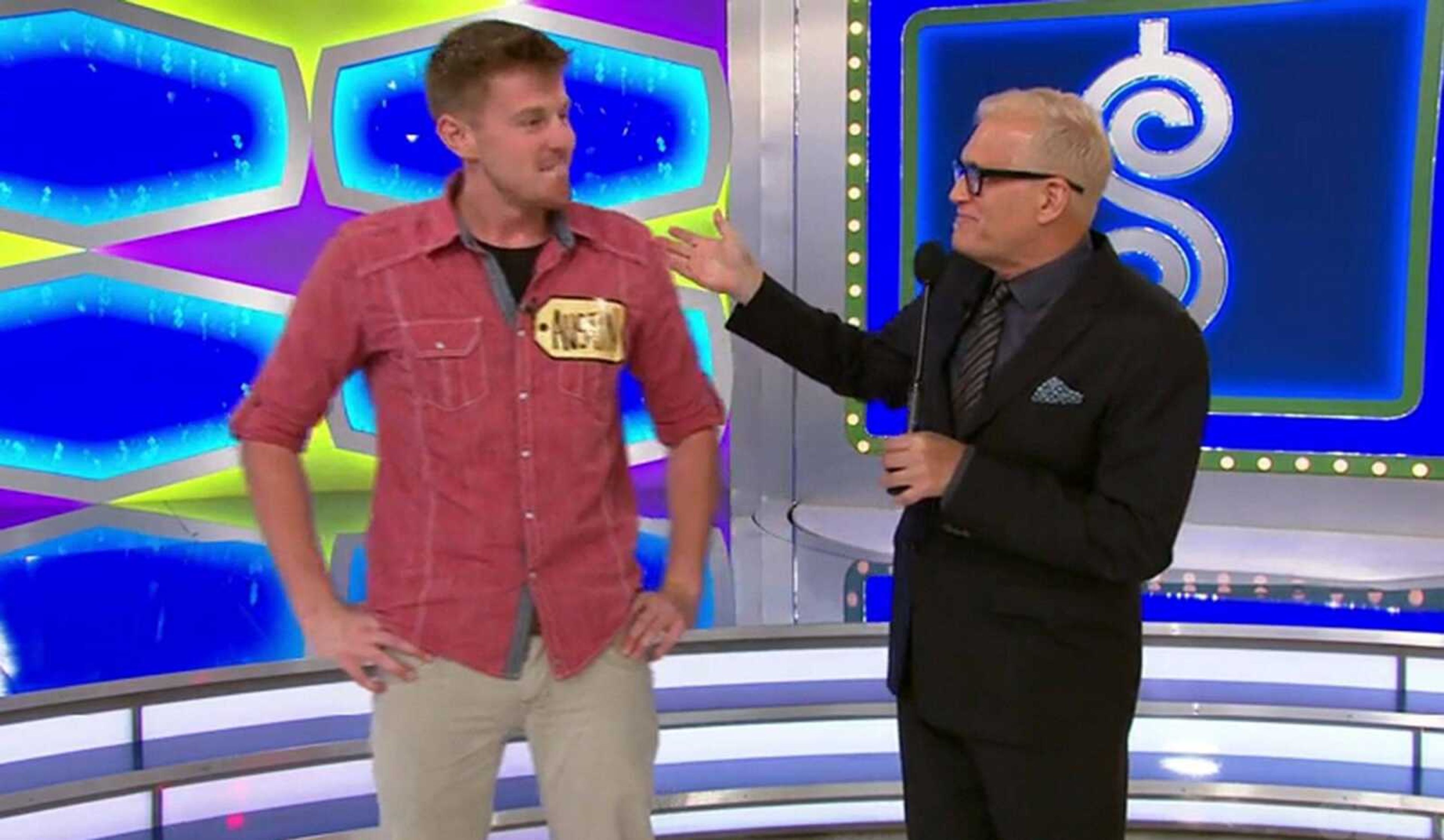 Austin Kwikkel is greeted by "The Price Is Right" host Drew Carey after advancing past the show's first round. (Screen capture)