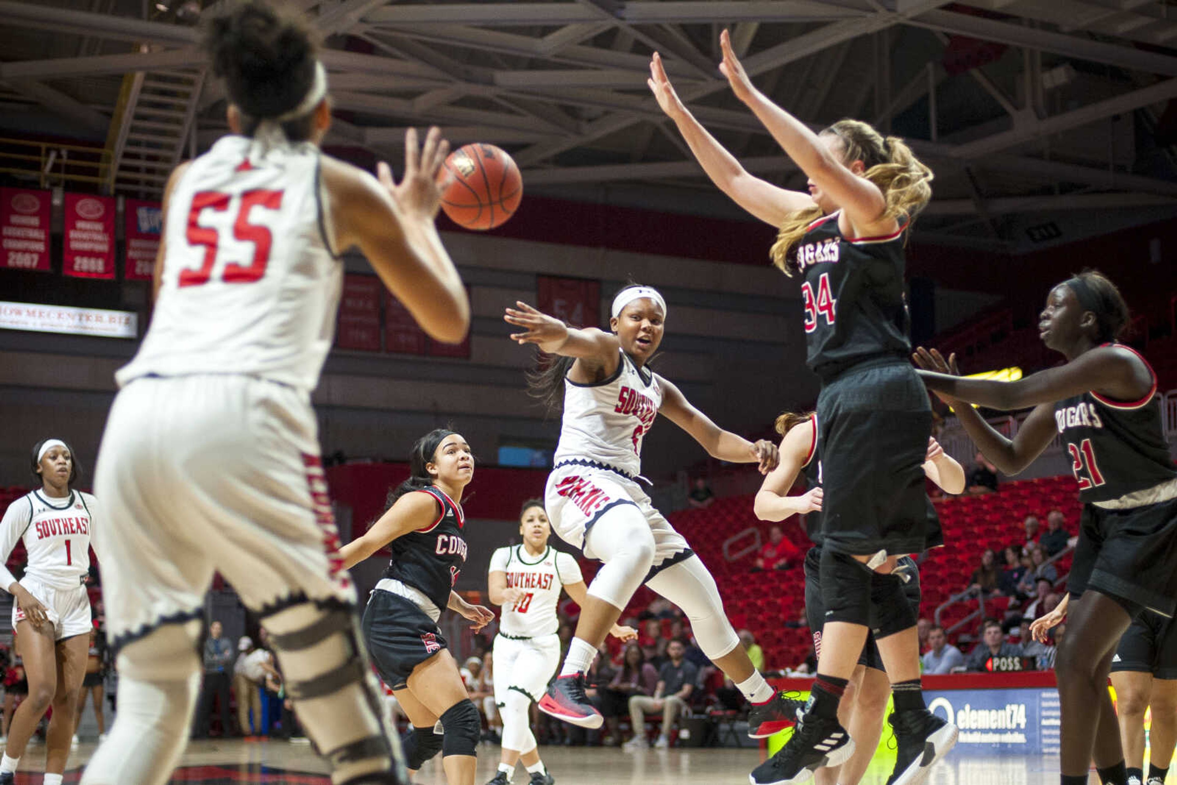 Southeast Missouri State University's Tionne Colyer (5) tosses the ball out of the paint during the Redhawks' home game against the SIUE Cougars Thursday, Jan. 24, 2019.