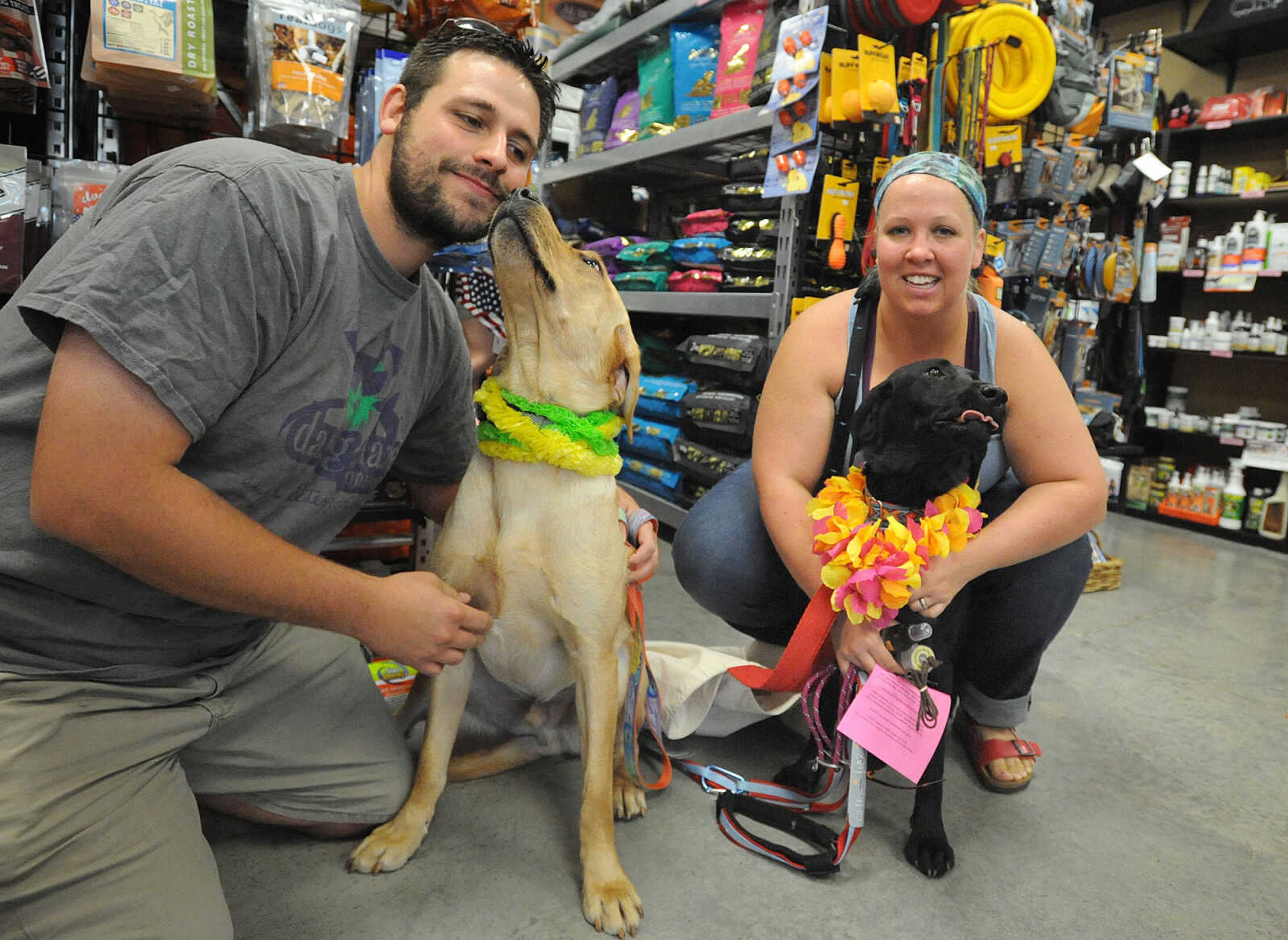 LAURA SIMON ~ lsimon@semissourian.com

Daniel Bradley and Liam, and Lex Dietz and Reilley pose for a photo, Saturday, July 12, 2014, during the Bow Wow Luau at Busch Pet Products and Care in Cape Girardeau.