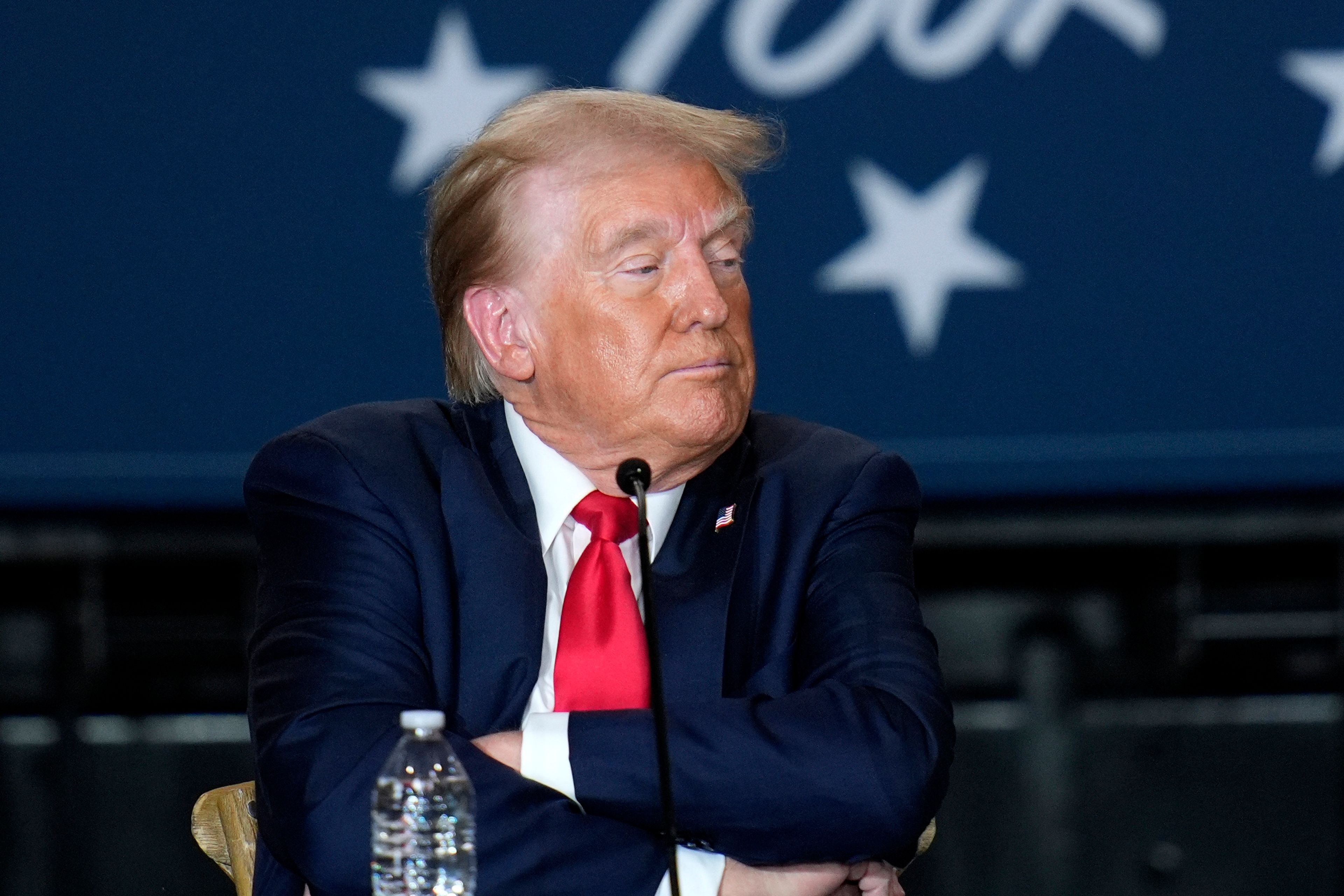 Republican presidential nominee former President Donald Trump listens at a campaign event at Beauty Society, Saturday, Oct. 12, 2024, in North Las Vegas, Nev. (AP Photo/John Locher)