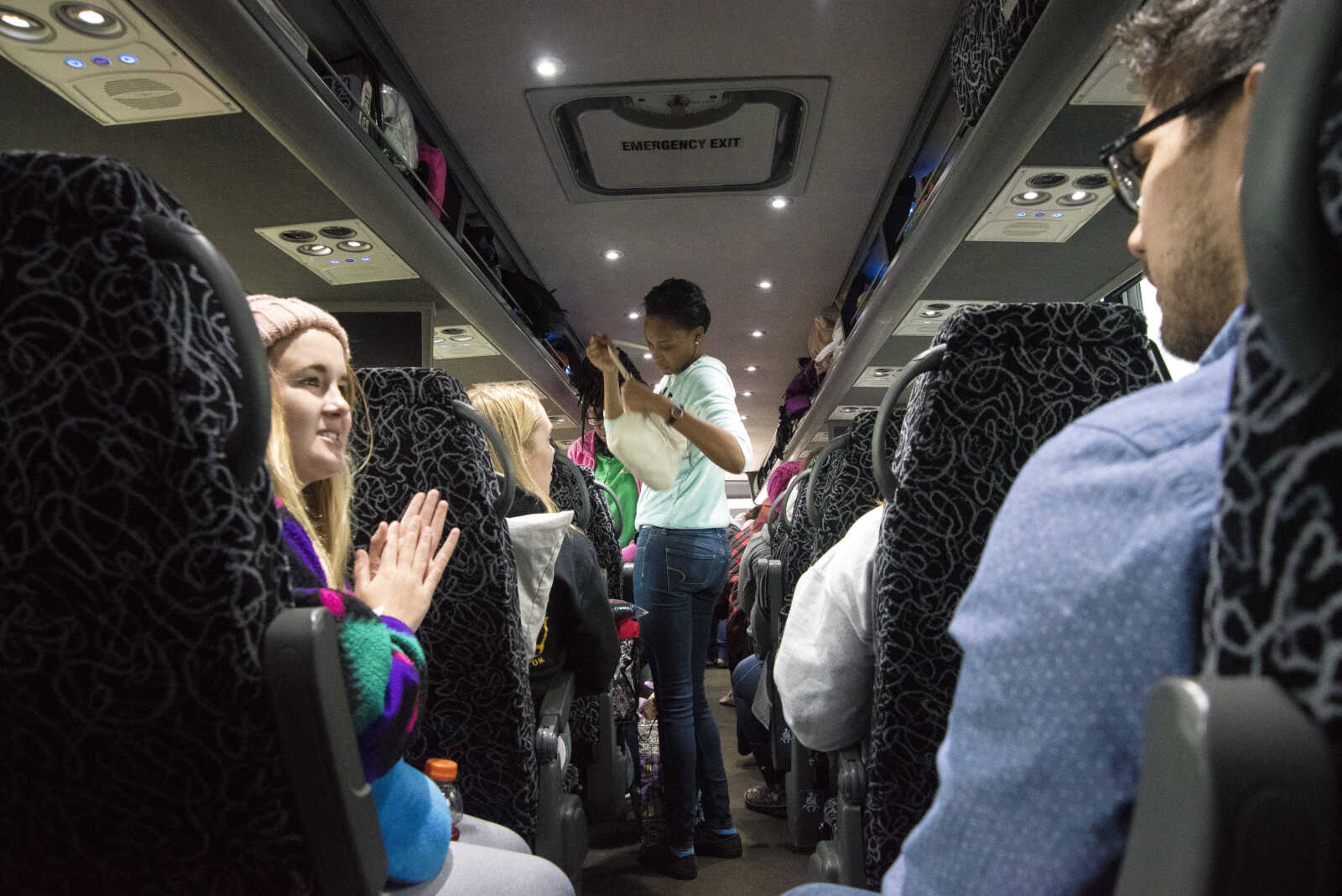 Protestors get ready to travel to Washington D.C. to participate in the Women's March on Saturday as they get ready to leave Friday, Jan. 20, 2017 in the Scully Building parking lot at Southeast Missouri State University in Cape Girardeau.