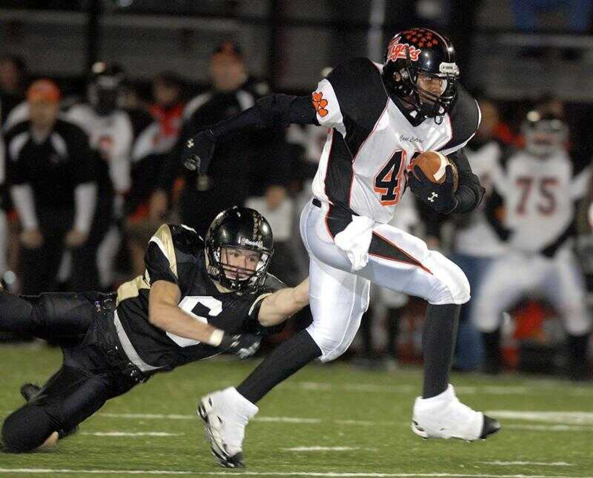 Central's Tyler Terry, right, found running room as Farmington's Max Robinson attempted to make the tackle during Wednesday's game.