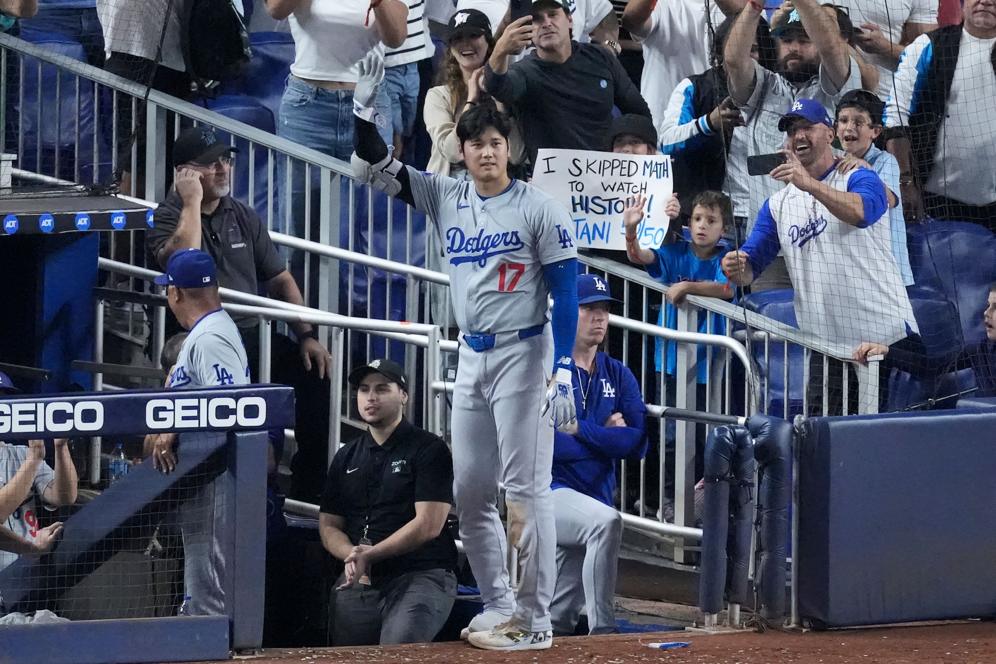 Los Angeles Dodgers' Shohei Ohtani (17) waves to fans after he hit a home run scoring Andy Pages, during the seventh inning of a baseball game against the Miami Marlins, Thursday, Sept. 19, 2024, in Miami. (AP Photo/Wilfredo Lee)