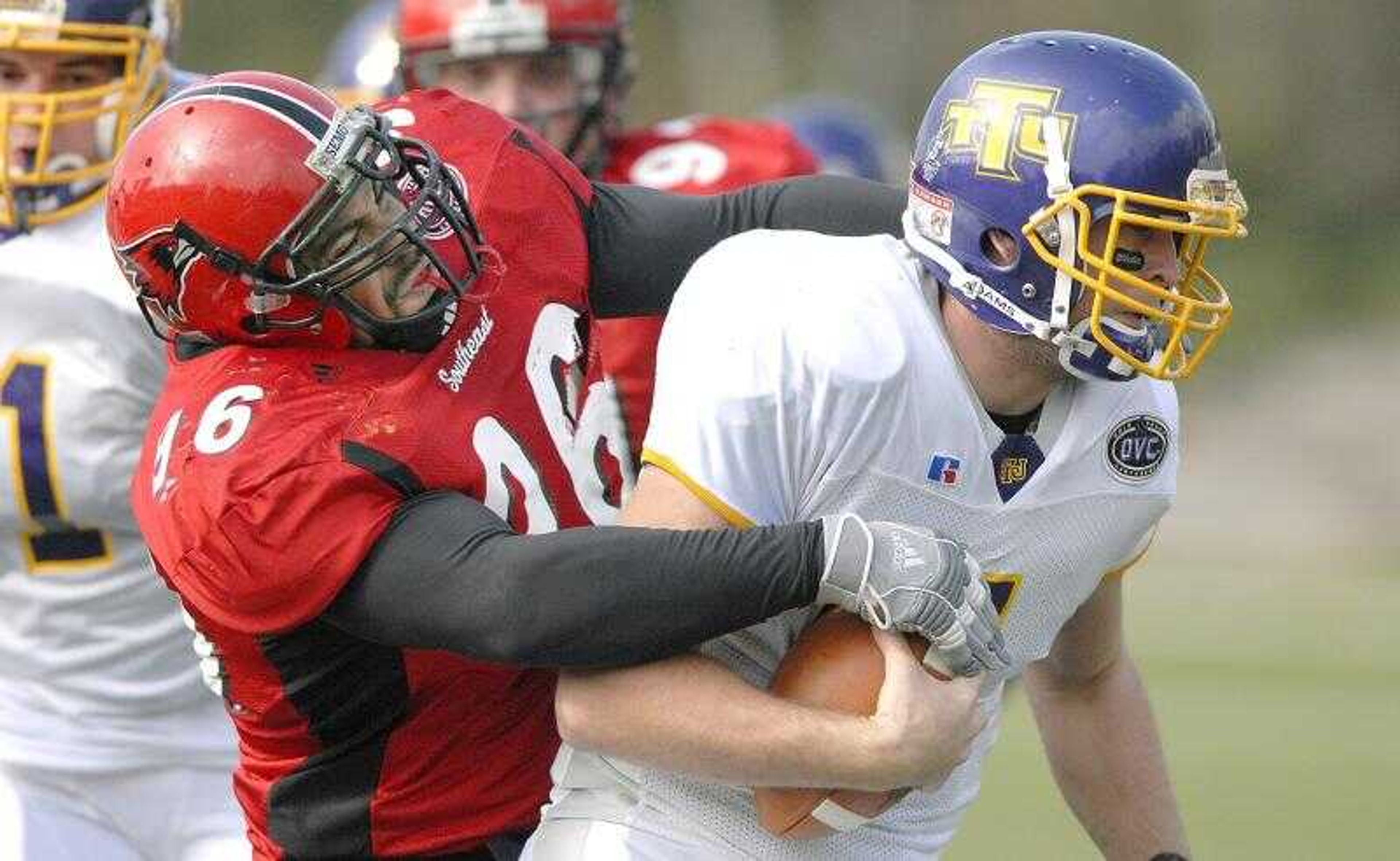 Southeast Missouri State's Jeff Steemer, left, tackled Tennessee Tech quarterback Lee Sweeney during Saturday's season-ending loss at Houck Stadium. Steemer was part of a senior-dominate defensive line which must be reconstructed next season. Southeast had 25 seniors on this year's 4-7 team. (Don Frazier)