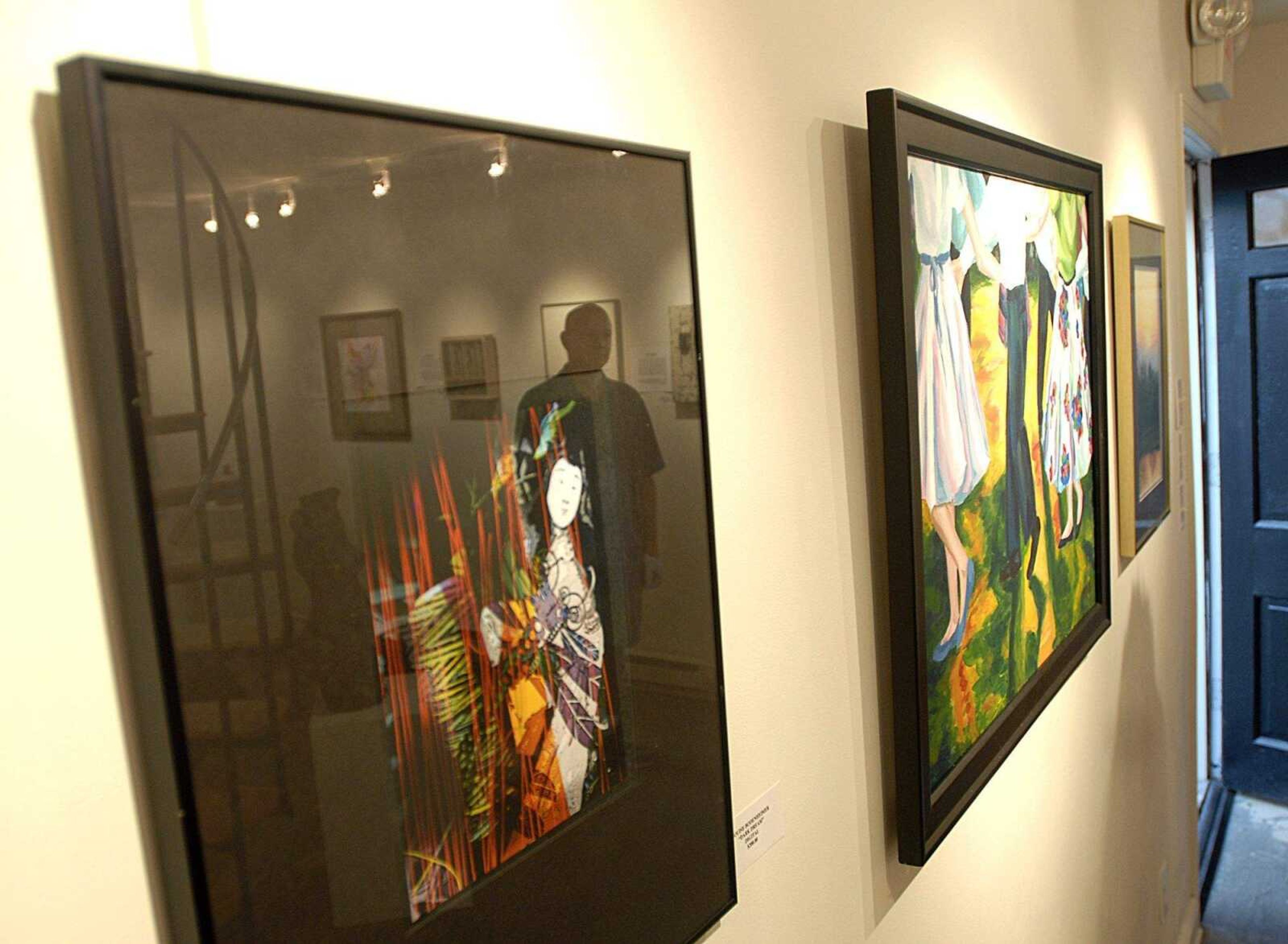 AARON EISENHAUER ~ aeisenhauer@semissourian.com
Craig Thomas is reflected in one of the pieces at his Black Door Gallery.