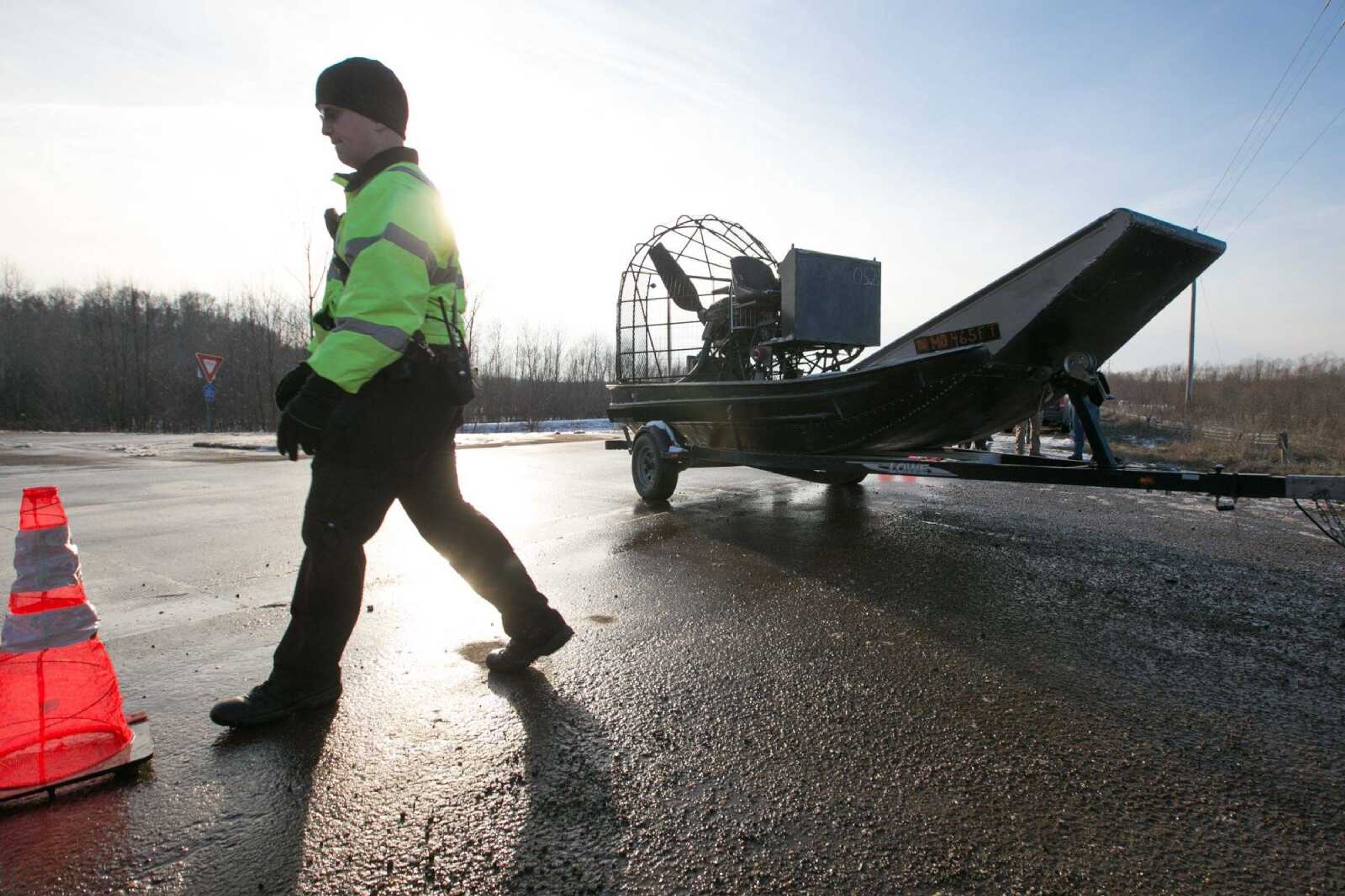 An airboat arrives at the scene where officials from several jurisdictions searched Wednesday for missing hunter Zack Johnston in Scott County.