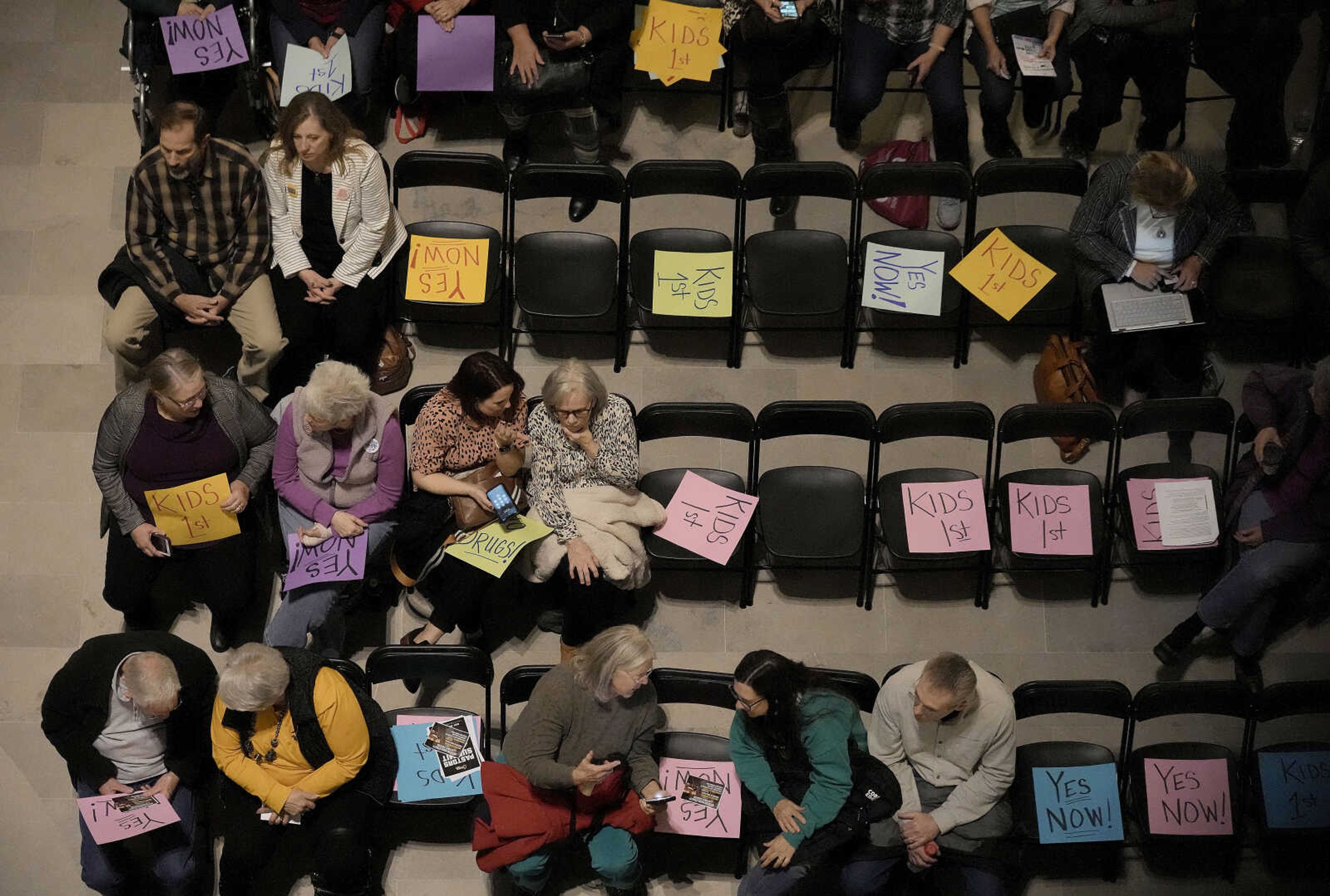 People wait for the start of a rally in favor of legislation banning gender-affirming health care for minors Monday at the Missouri Statehouse in Jefferson City.