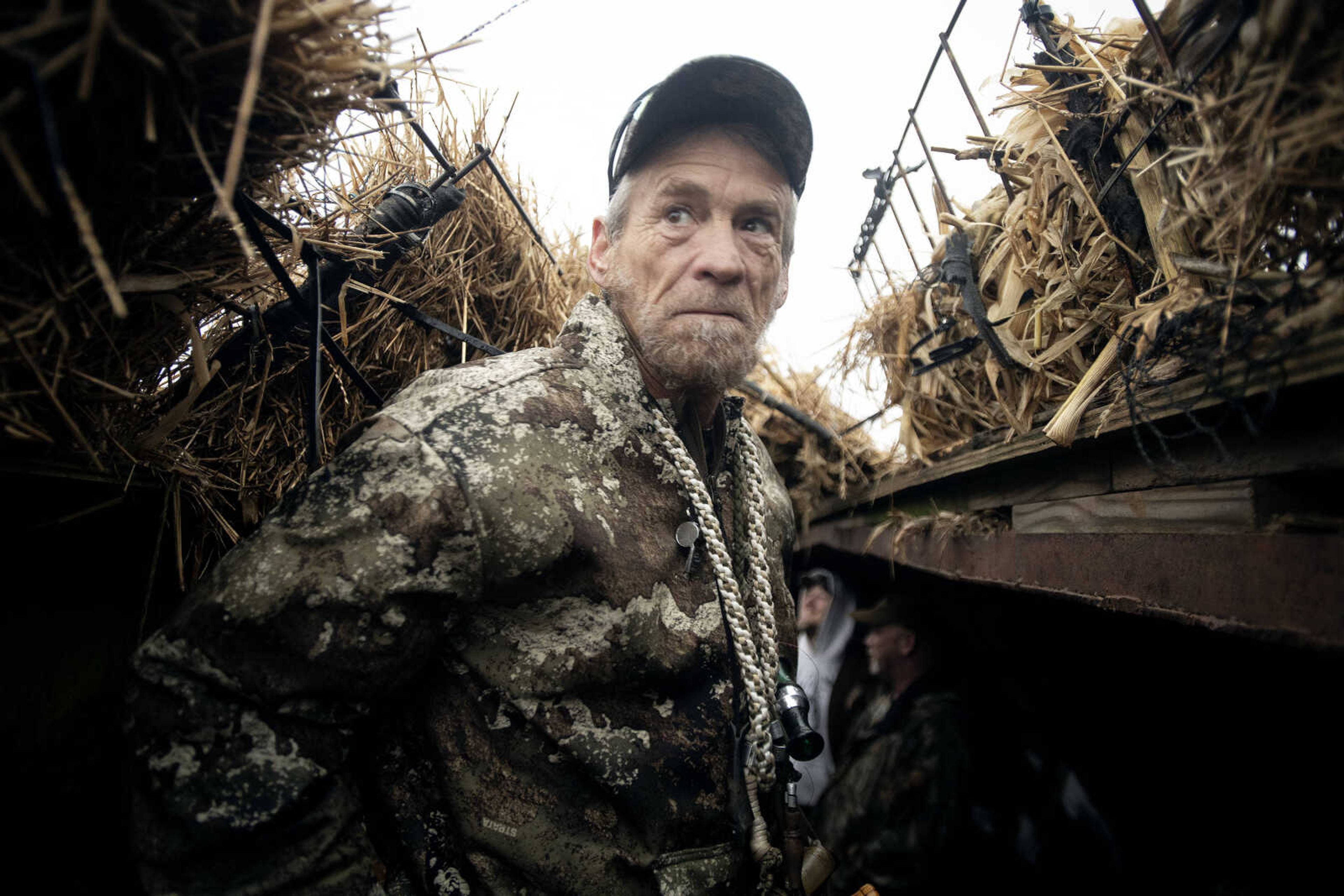 AM Vets Outdoors founder and Air Force veteran Bill Coomer, aka "Wild Bill," of Cape Girardeau looks out of a blind during a snow geese hunt Saturday, March 14, 2020, in Ware, Illinois.