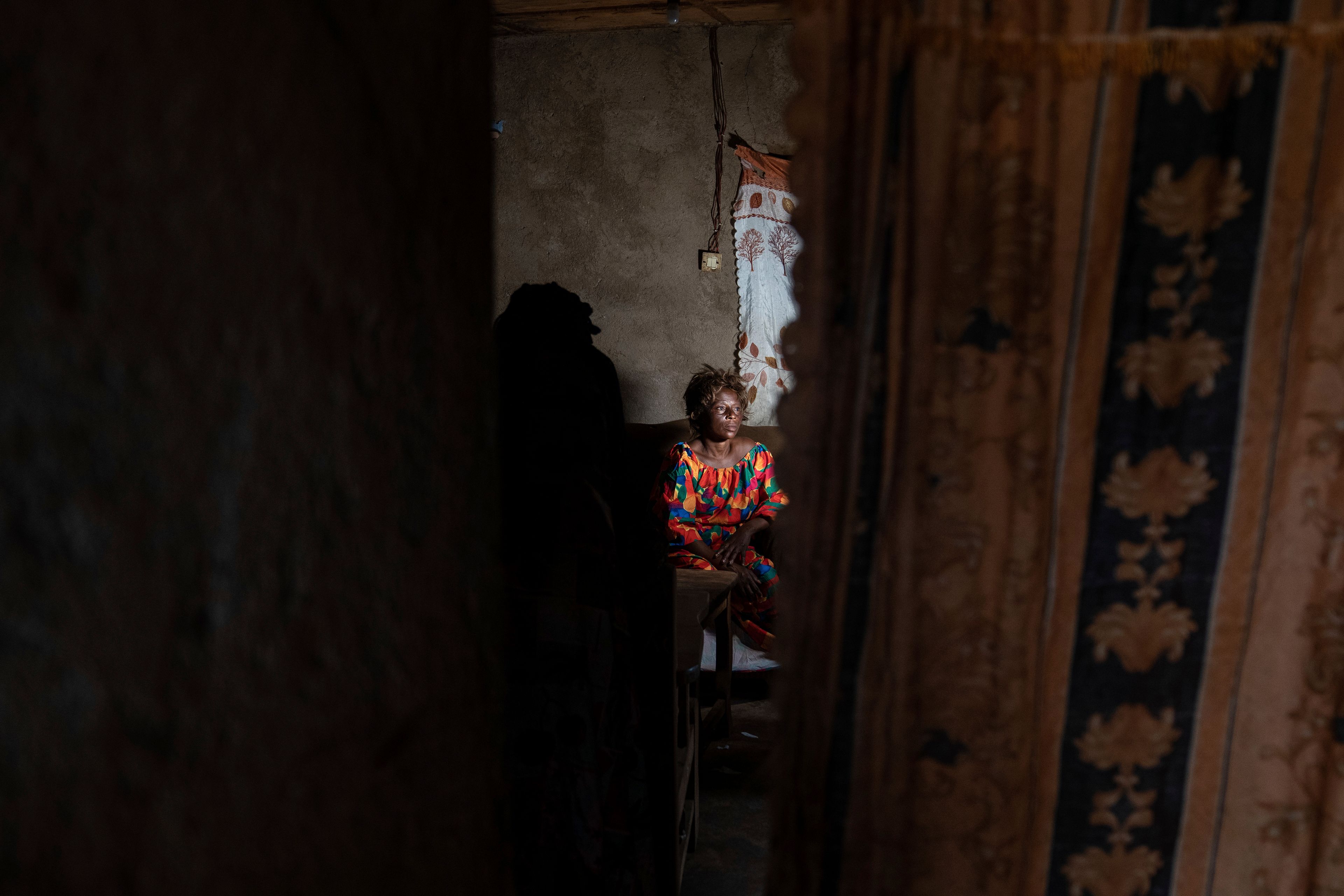 Sifa kungonja, 40, sits at home after recovering from mpox, on Sept. 4, 2024, in Kamituga, in eastern Congo's South Kivu province, which is the epicenter of the world's latest outbreak of the disease. (AP Photo/Moses Sawasawa)