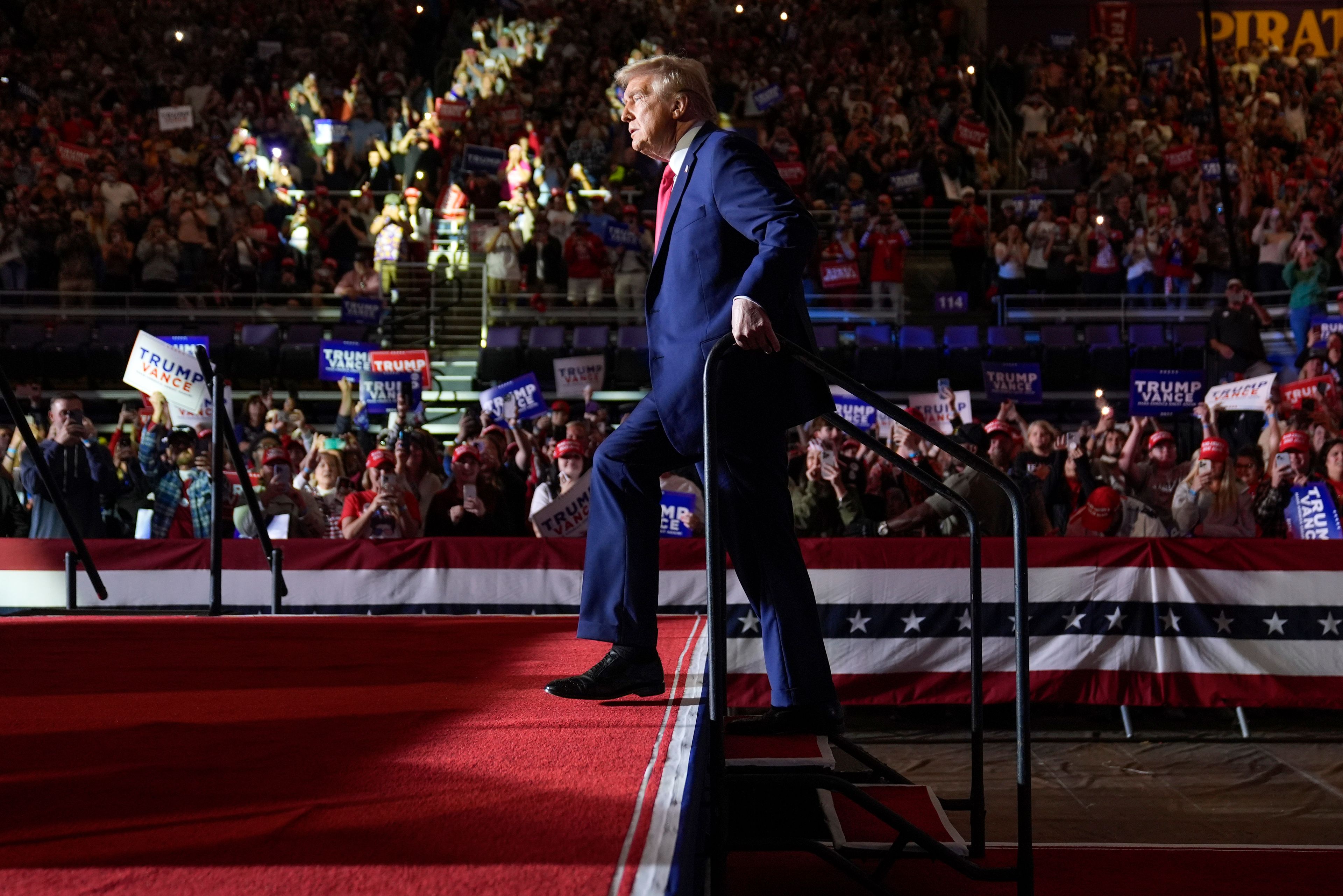 Republican presidential nominee former President Donald Trump arrives for a campaign rally at Williams Arena at Mignes Coliseum, Monday, Oct. 21, 2024, in Greenville, N.C. (AP Photo/Evan Vucci)