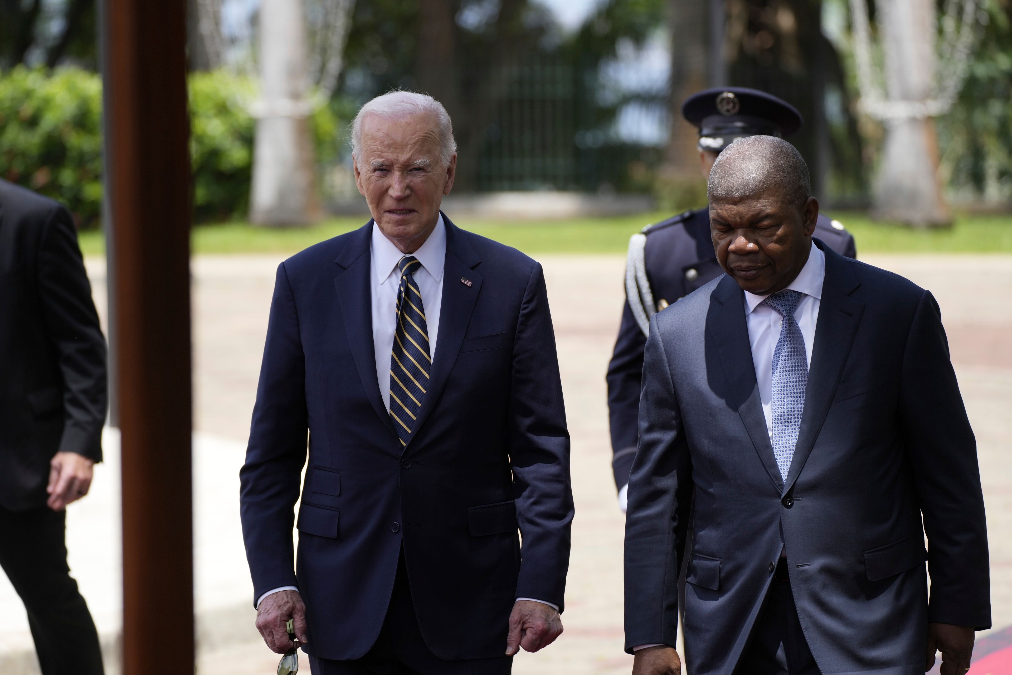 President Joe Biden walks with Angola's President Joao Lourenco, at the presidential palace in the capital Luanda, Angola on Tuesday, Dec. 3, 2024. (AP Photo/Ben Curtis)