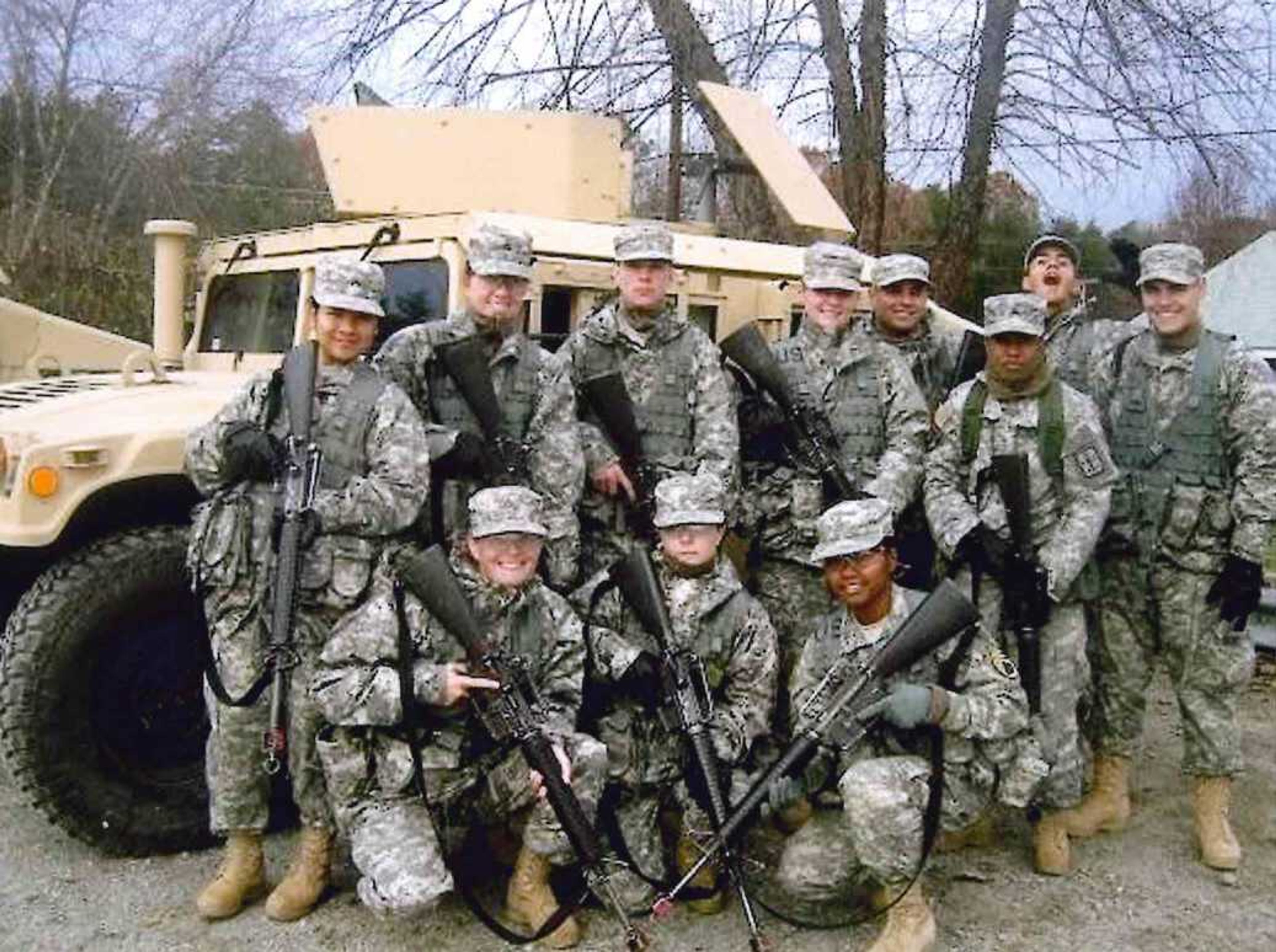 The camaraderie of serving with others is a focal point of Erin Tomkins' military career. Tomkins, back row second from left, said her section in the Army Guard's 1140th Engineer Battalion is especially close-knit.