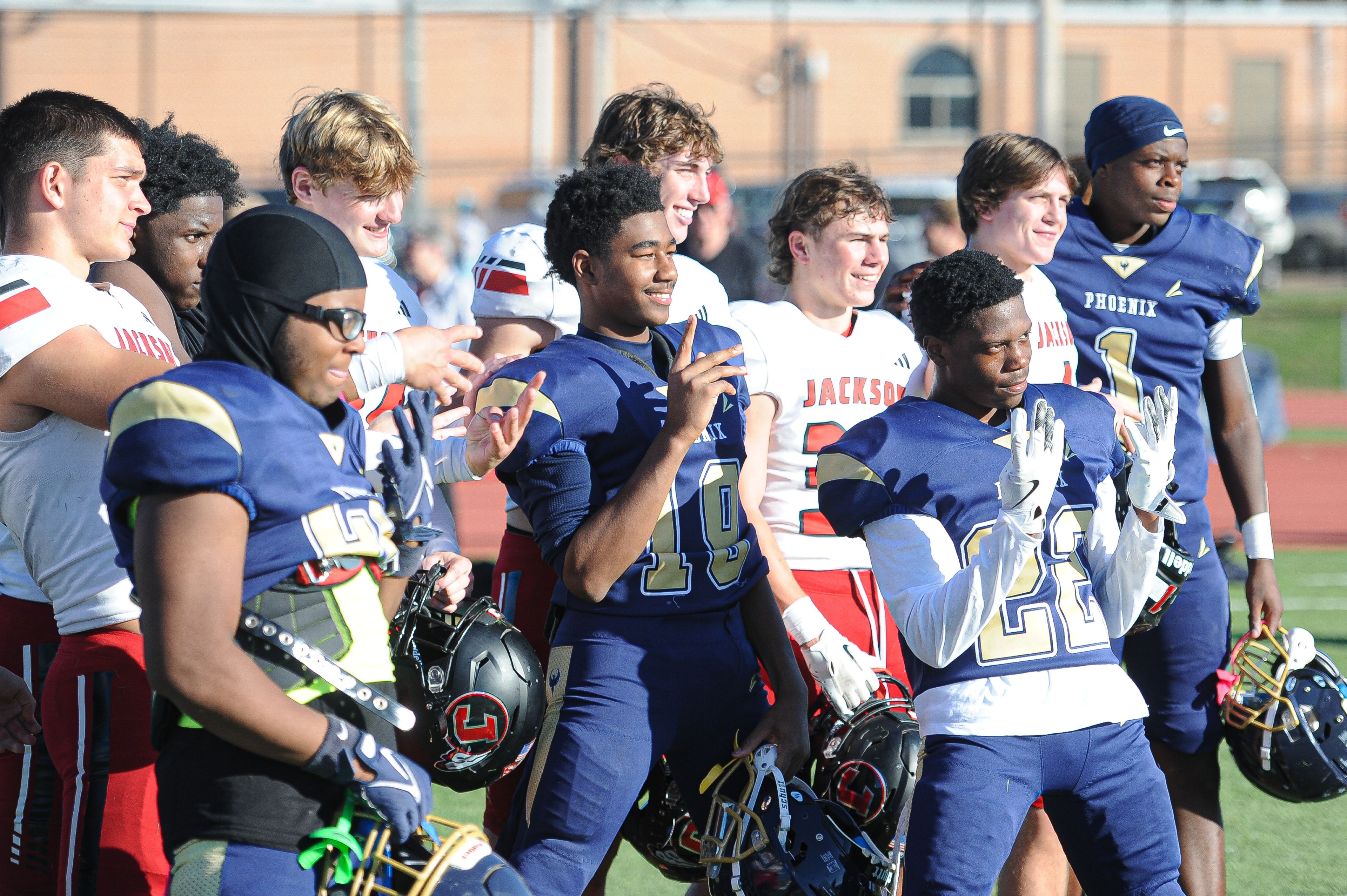 Jackson and Miller Career/Vashon players take a group photo during a Saturday, October 19, 2024 game between the Miller Career/Vashon Phoenix and the Jackson Indians at Gateway STEM High School in St. Louis. Jackson defeated Miller Career, 55-14.