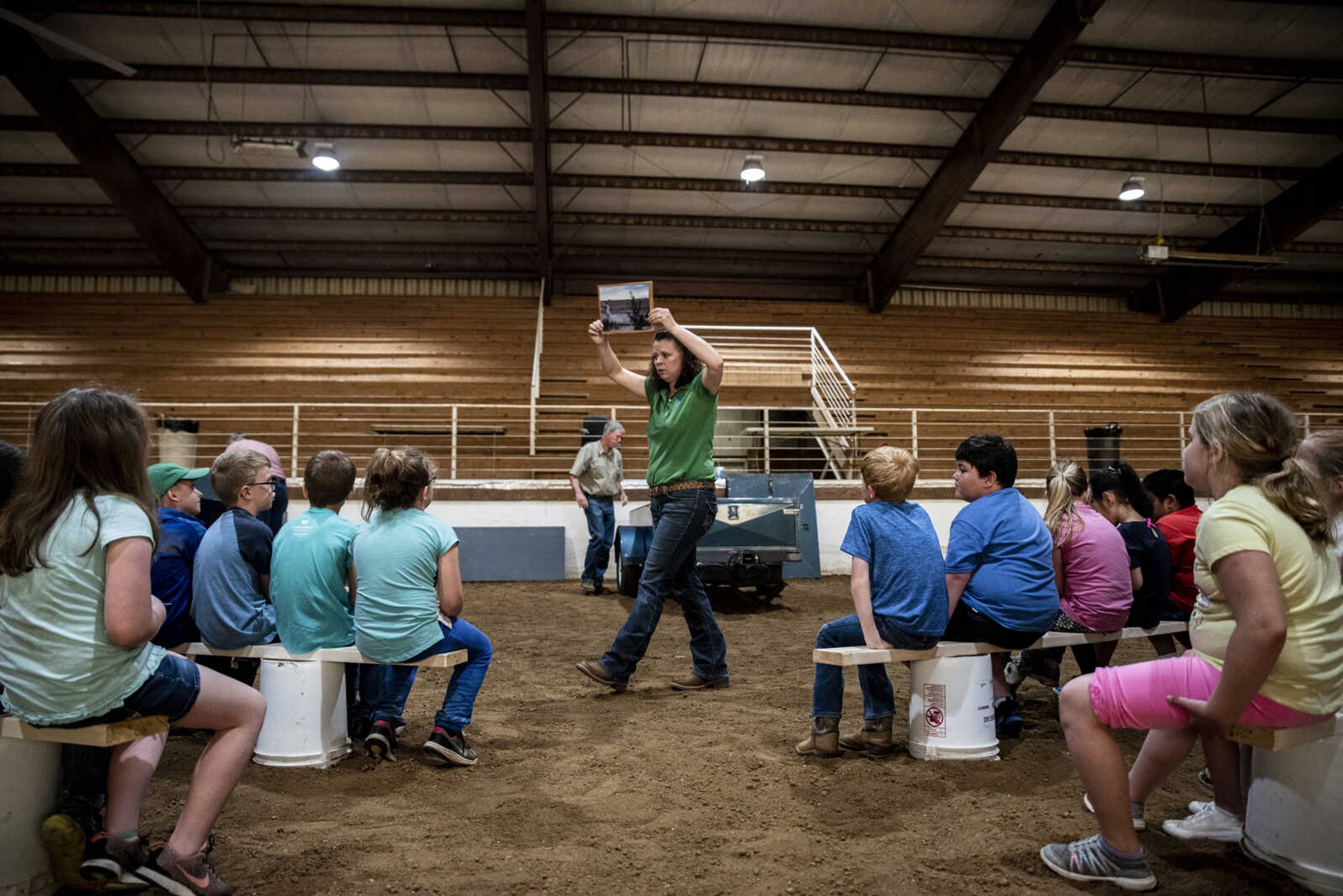 Dana Seibel, soil conservationist with Natural Resources Conservation Service (NRCS), talks to second graders about stream erosion and cleanliness during the 24th annual Farm Day sponsored by the Southeast Missouri Cattlemen's Association at Flickerwood Arena Wednesday, April 24, 2019, in Jackson. Over 800 students attended Farm Day and learned about a variety of farm-related topics from forestry to soil conservation, as well as farm animals and honey bees.