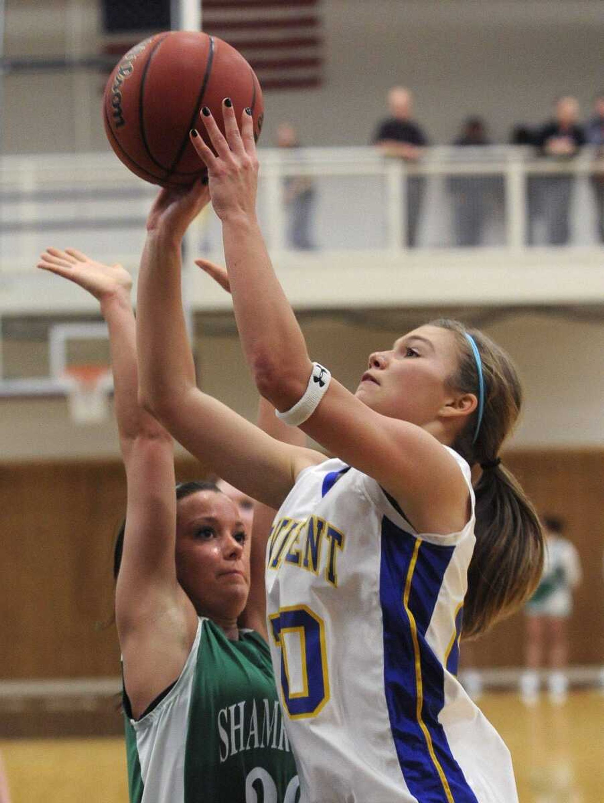 St. Vincent's Kayla Seabaugh takes a shot while New Haven's Taylor Willimann defends during the third quarter of the Class 2 District 4 title game Friday. Seabaugh finished with seven points.