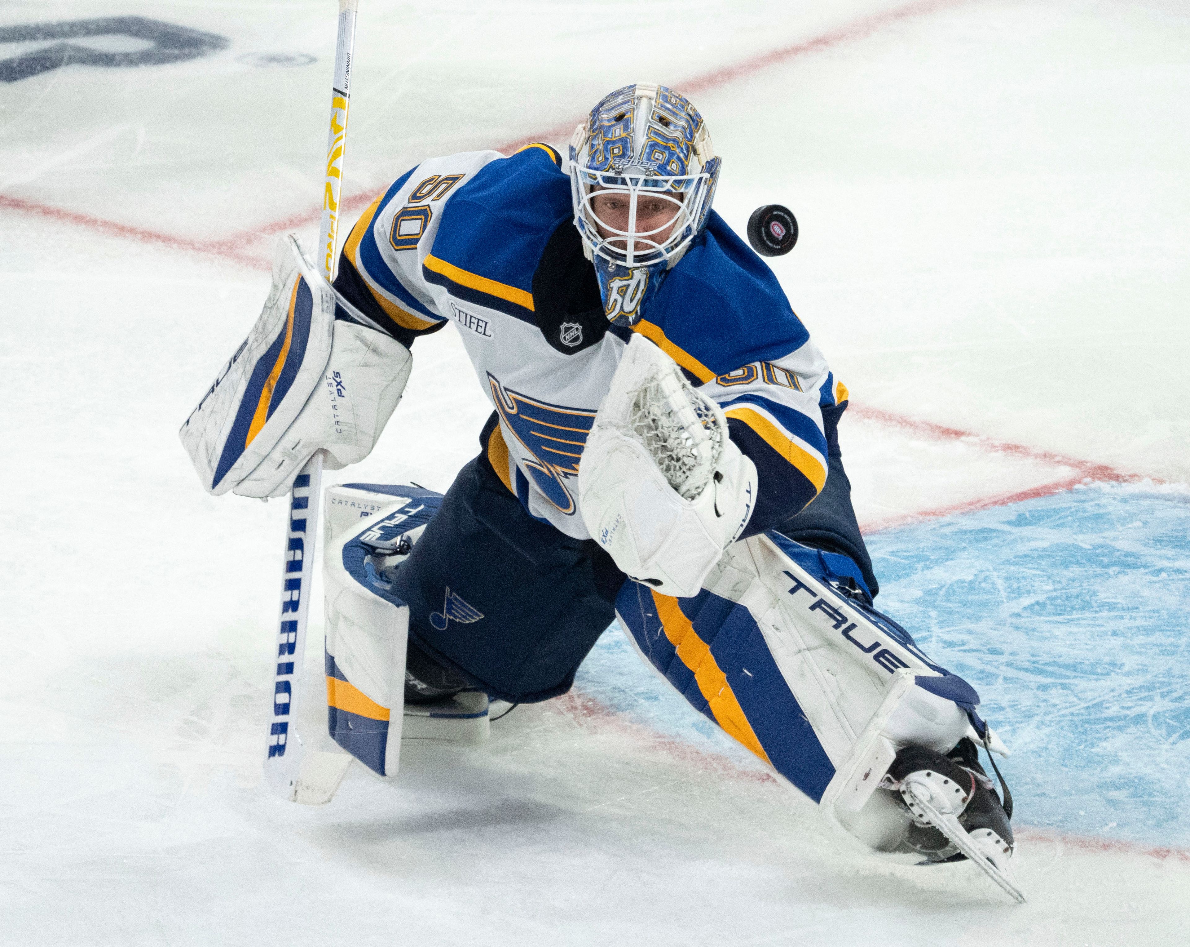 St. Louis Blues goaltender Jordan Binnington (50) makes a save during second period NHL hockey action against the Montreal Canadiens Saturday, October 26, 2024 in Montreal. (Ryan Remiorz/The Canadian Press via AP)