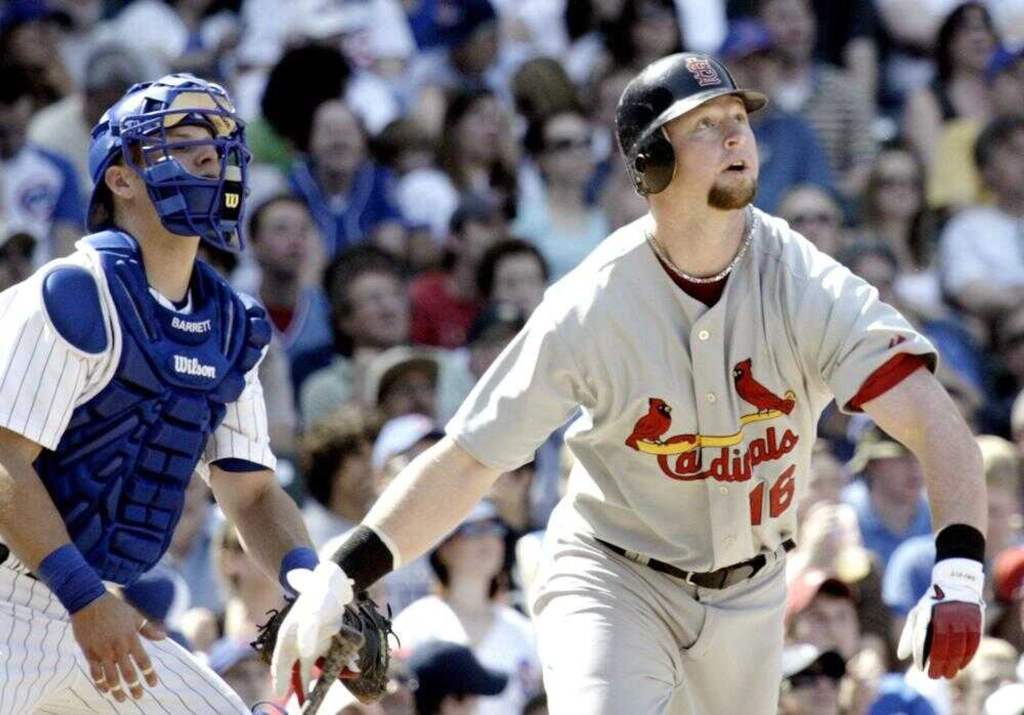 The Cardinals' Chris Duncan watched his three-run home run along with Cubs catcher Michael Barrett during the sixth inning Sunday at Wrigley Field in Chicago. (JAMES A. FINLEY ~ Associated Press)