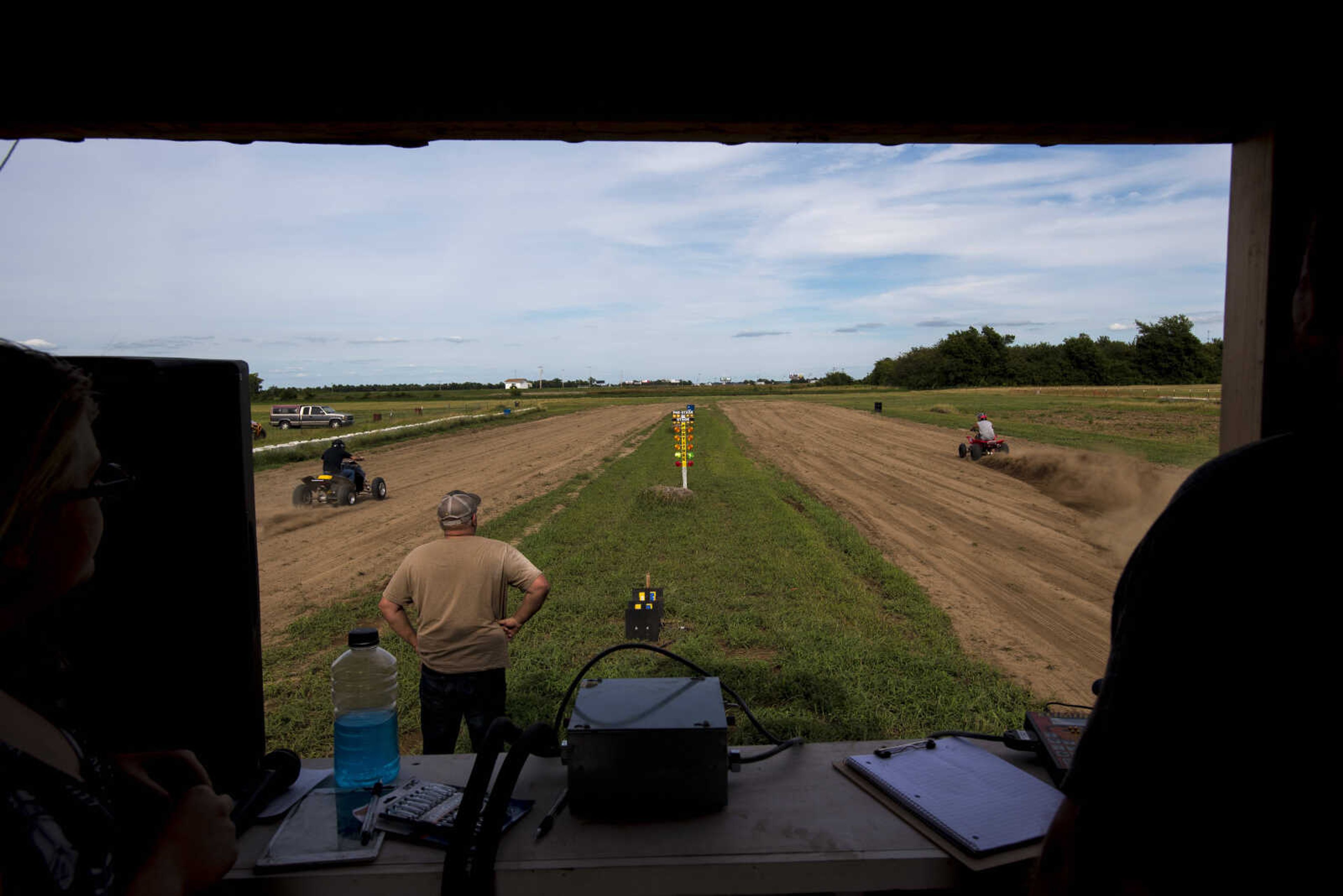 Two ATVs race off during a ATV trial drag race at the Missouri Dirt Motorsports Saturday, August 12, 2017 in Sikeston.