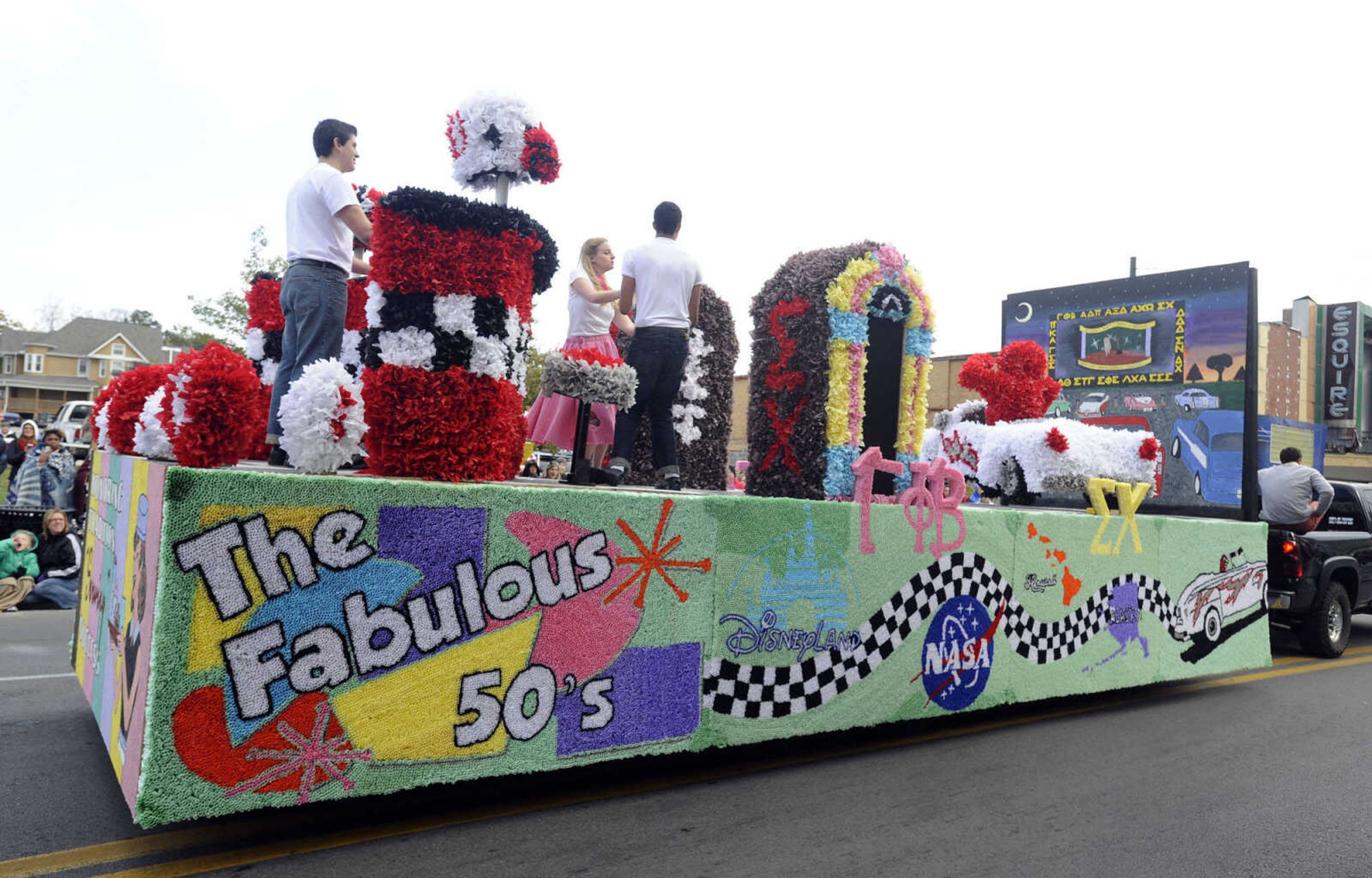 "The Fabulous '50s" float sponsored by Gamma Phi Beta and Sigma Chi cruises down Broadway in the SEMO Homecoming parade Saturday, Oct. 26, 2013.